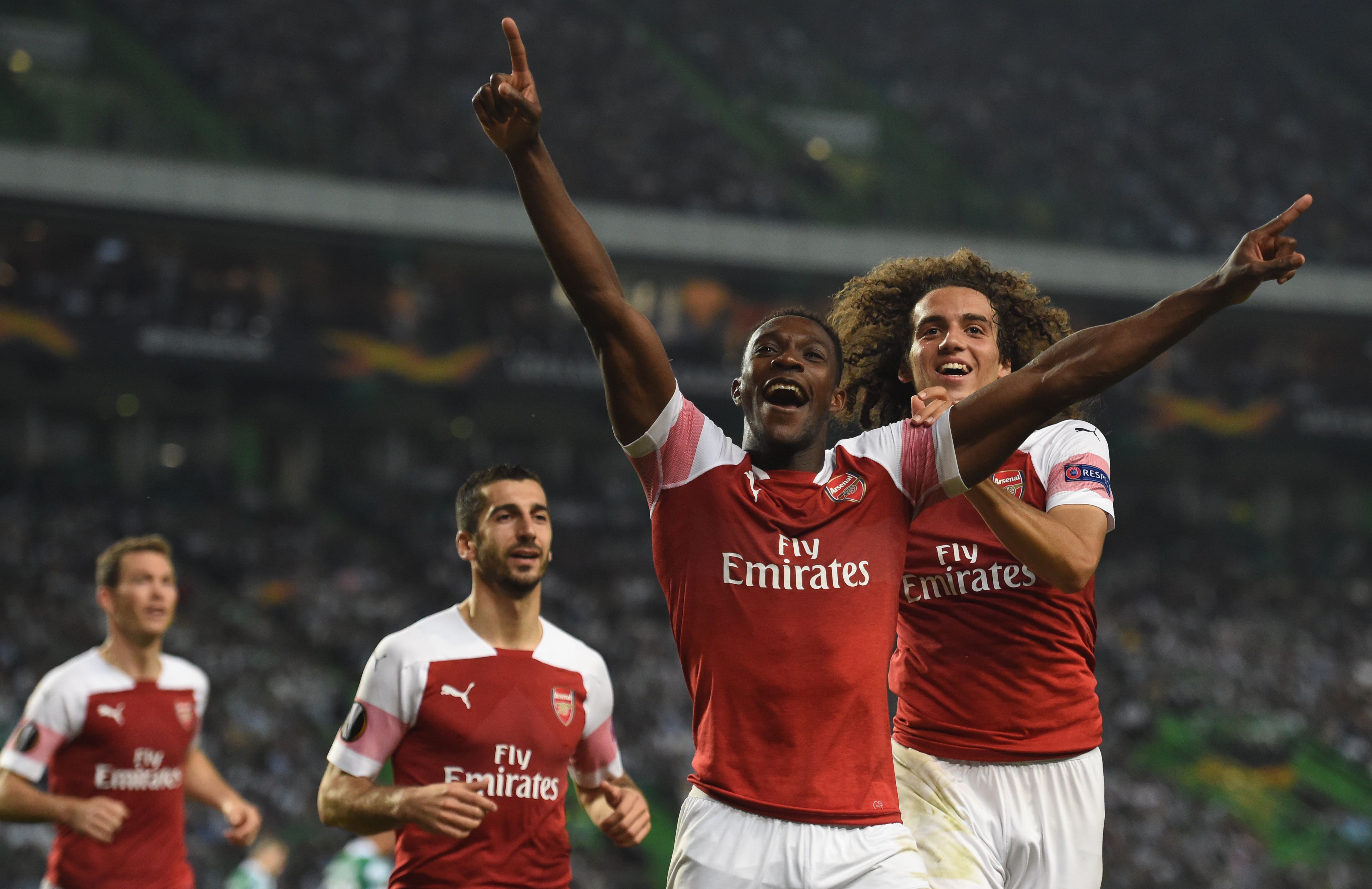 Selebrasi Danny Welbeck serelah menjebol gawang Sporting