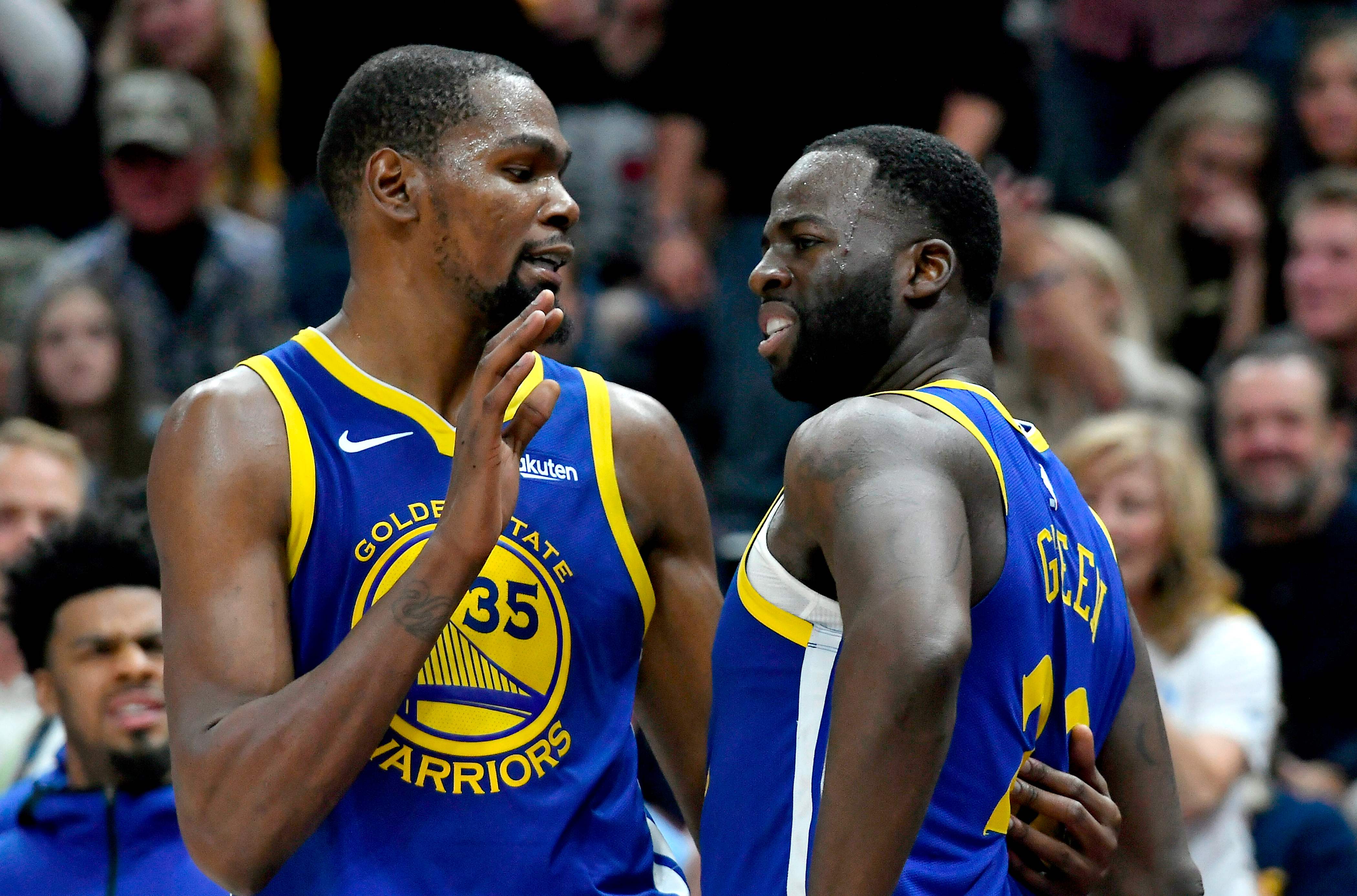 Kevin Durant (kiri) dan Draymond Green