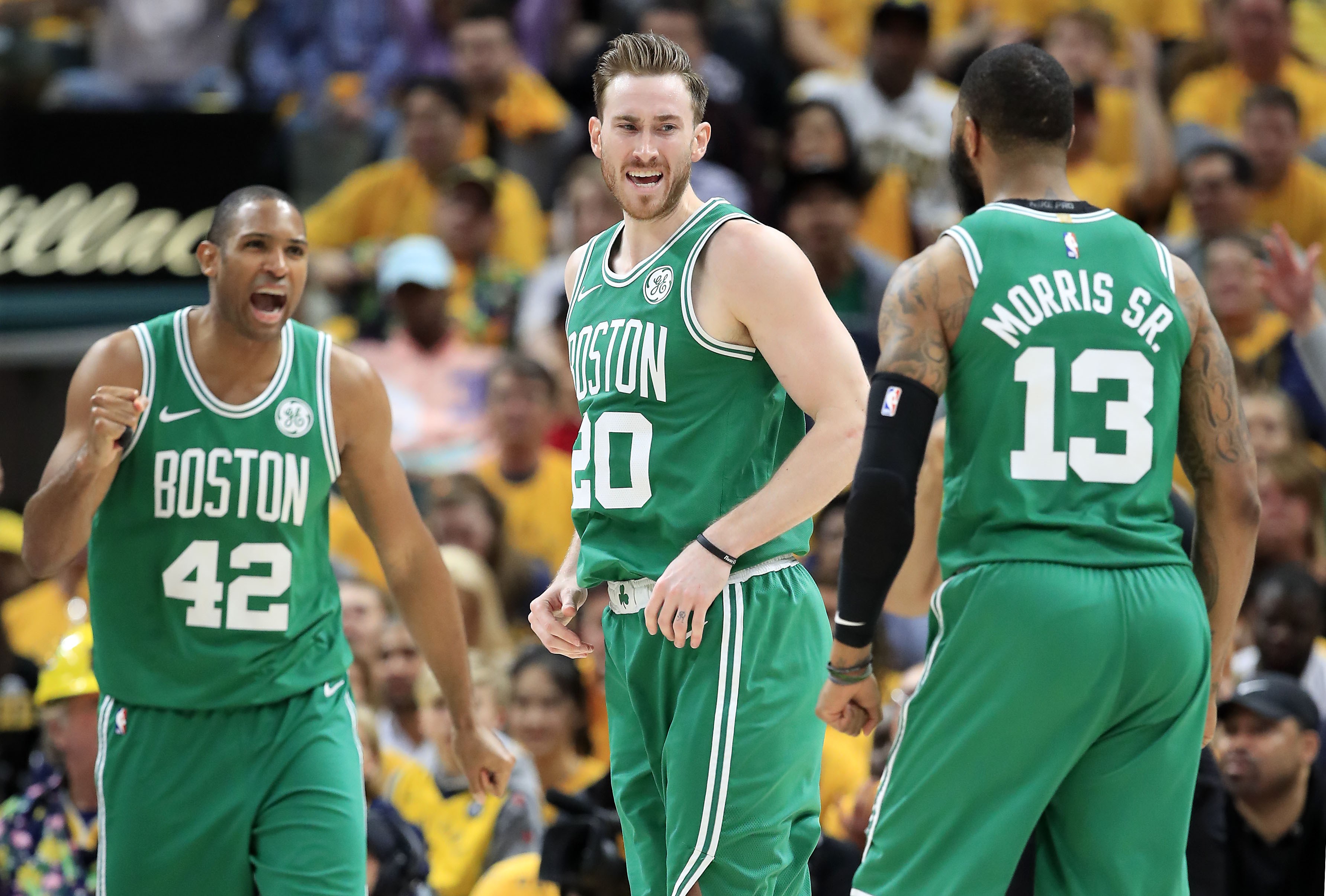 Al Horford,Gordon Hayward, dan Marcus Morris merayakan kemenangan Celtics atas Pacers.