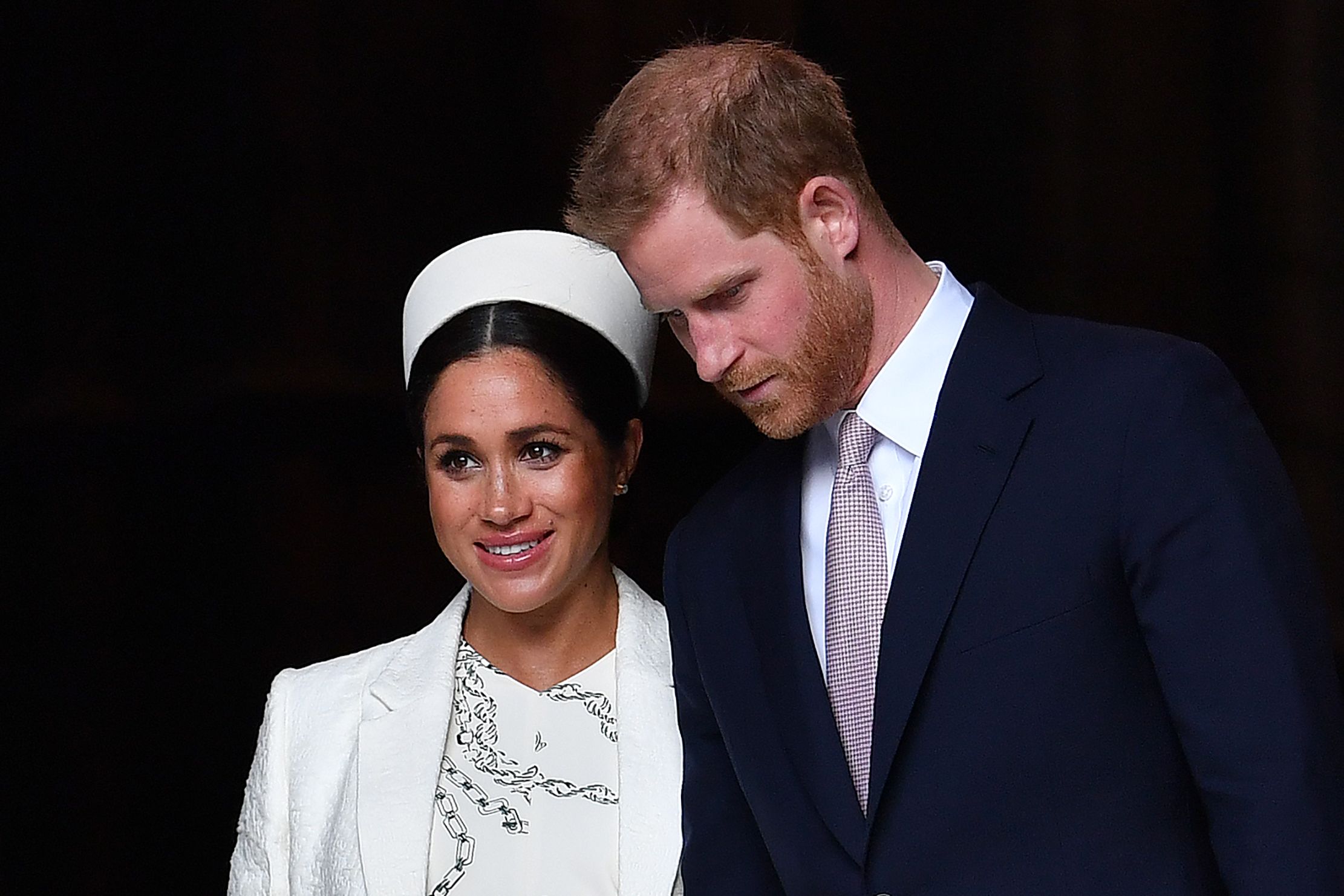 Pangeran Harry (kanan) dan istrinya Meghan