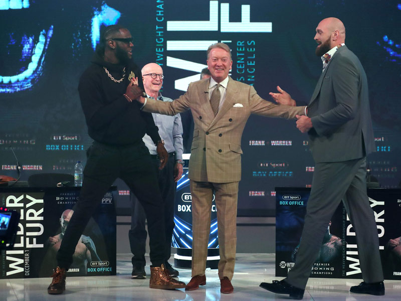 Deontay Wilder (kiri) dan Tyson Fury (kanan)