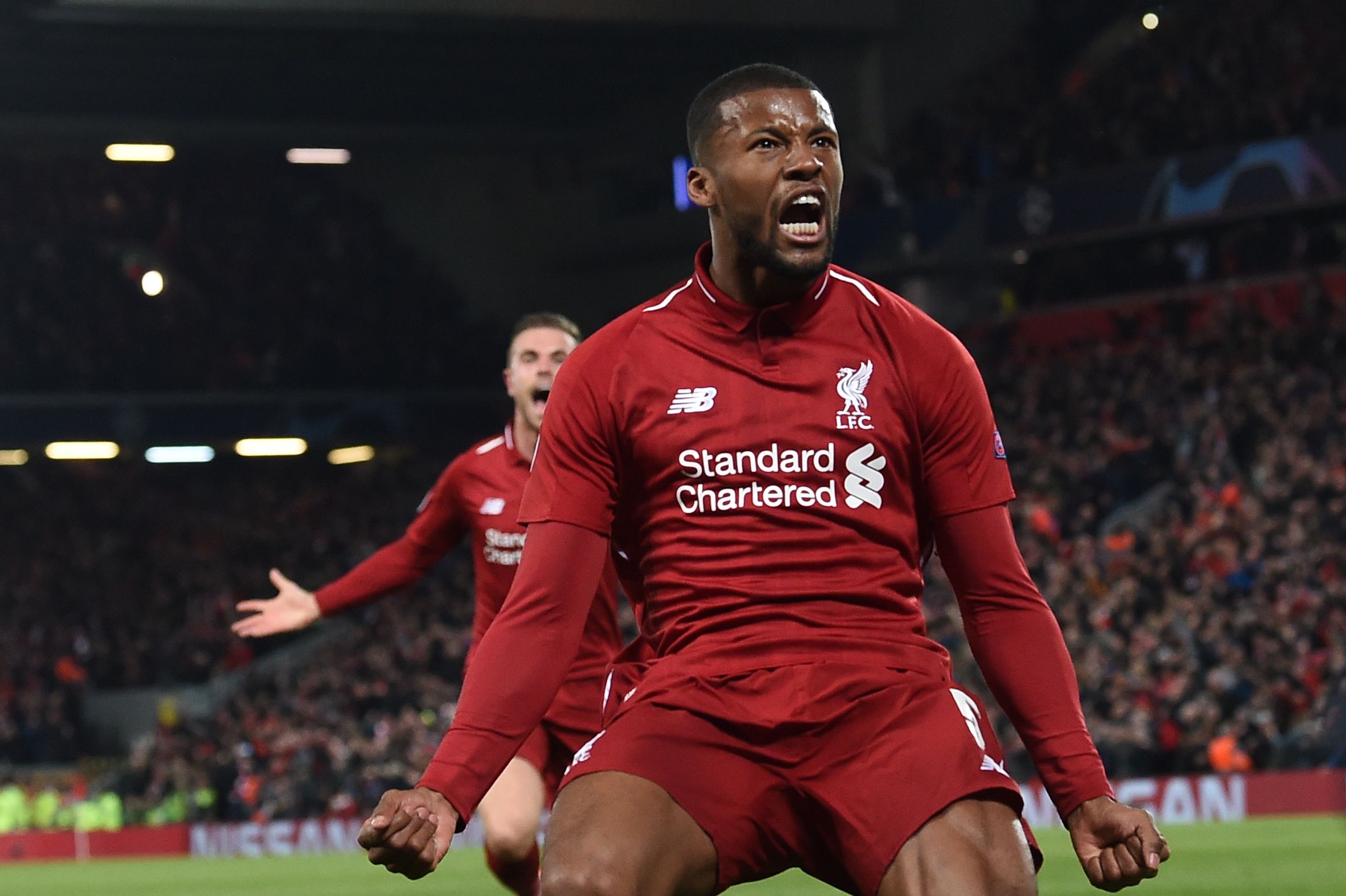 Georginio Wijnaldum melakukan selebrasi usai mencetak gol ketiga Liverpool ke gawang Barcelona di Anfield.