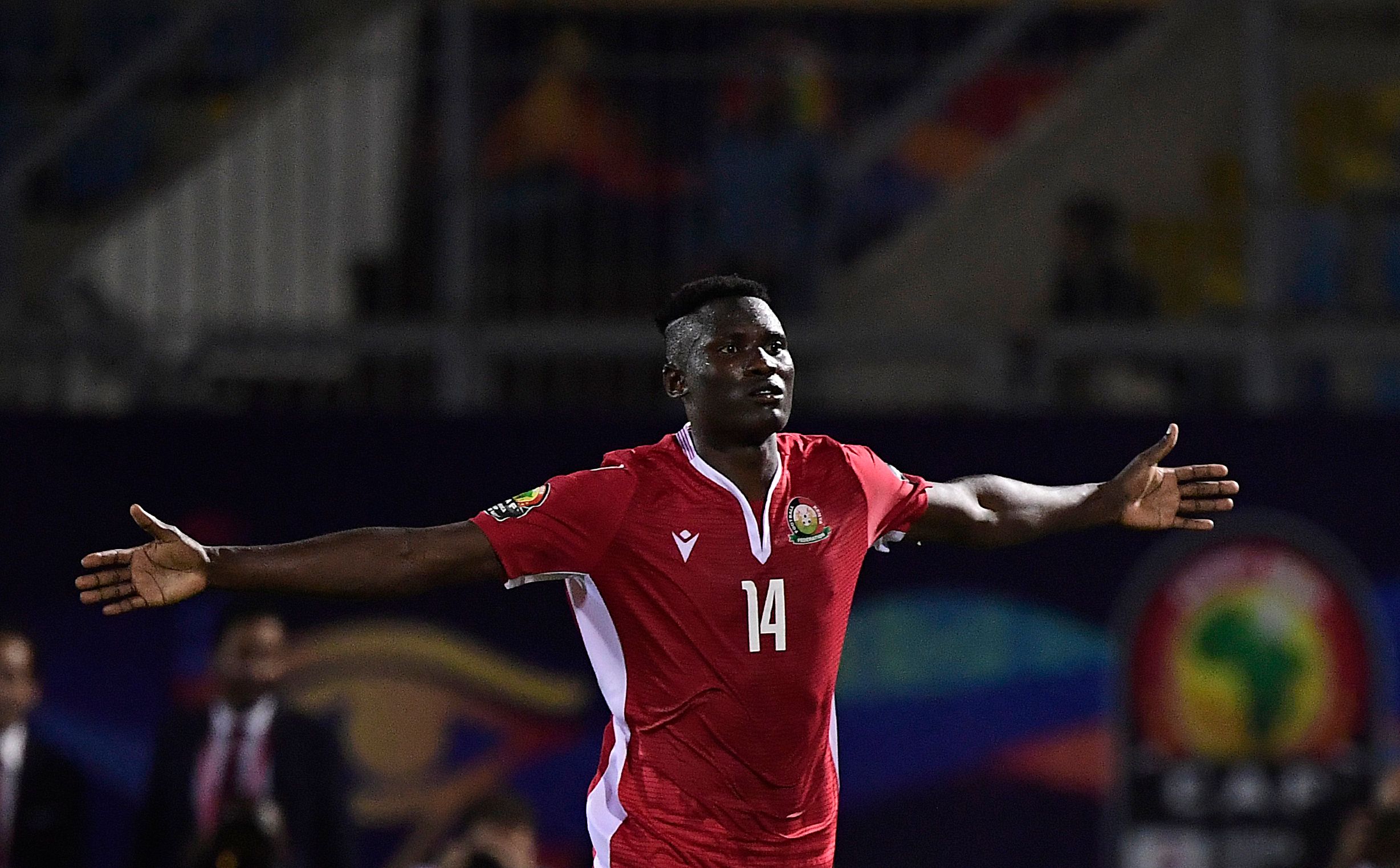 Penyerang Kenya Michael Olunga merayakan golnya ke gawang Tanzania.