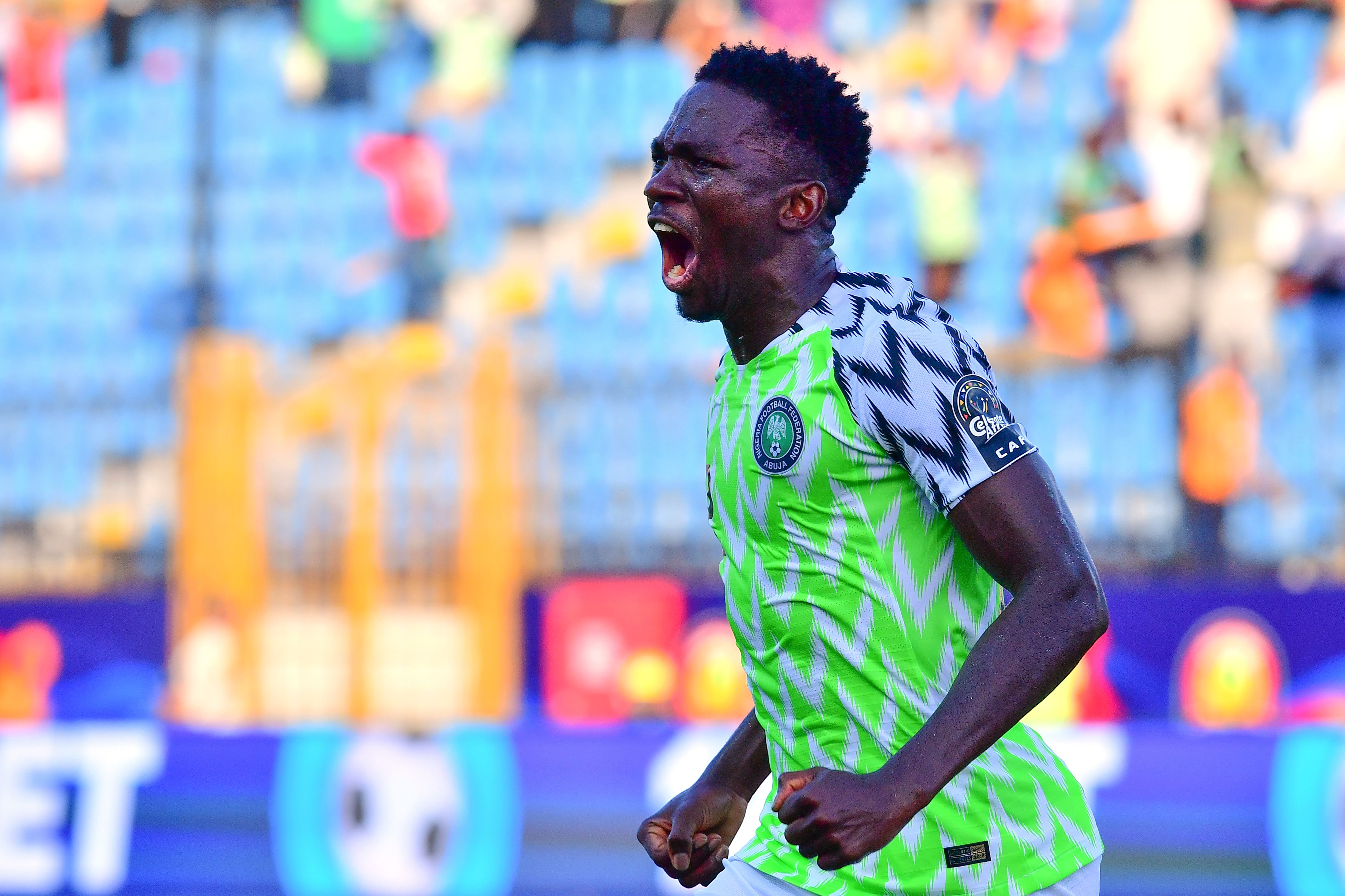 Pemain belakang Nigeria Kenneth Omeuro merayakan golnya ke gawang Guinea