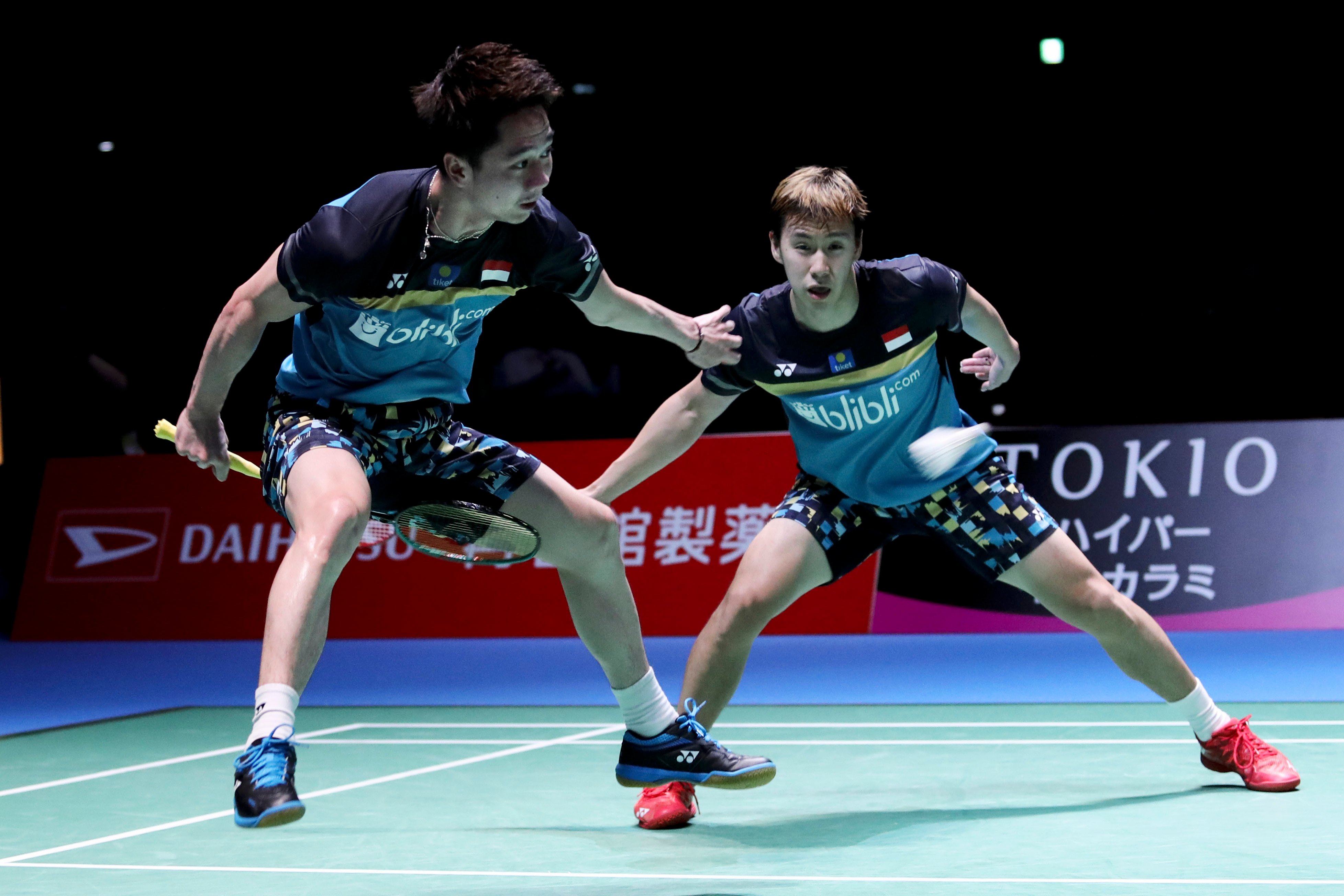 Ganda putra Indonesia Kevin Sanjaya Sukamuljo (kiri) dan Marcus Fernaldi Gideon pada semifinal Japan Open 2019, Sabtu (27/7).