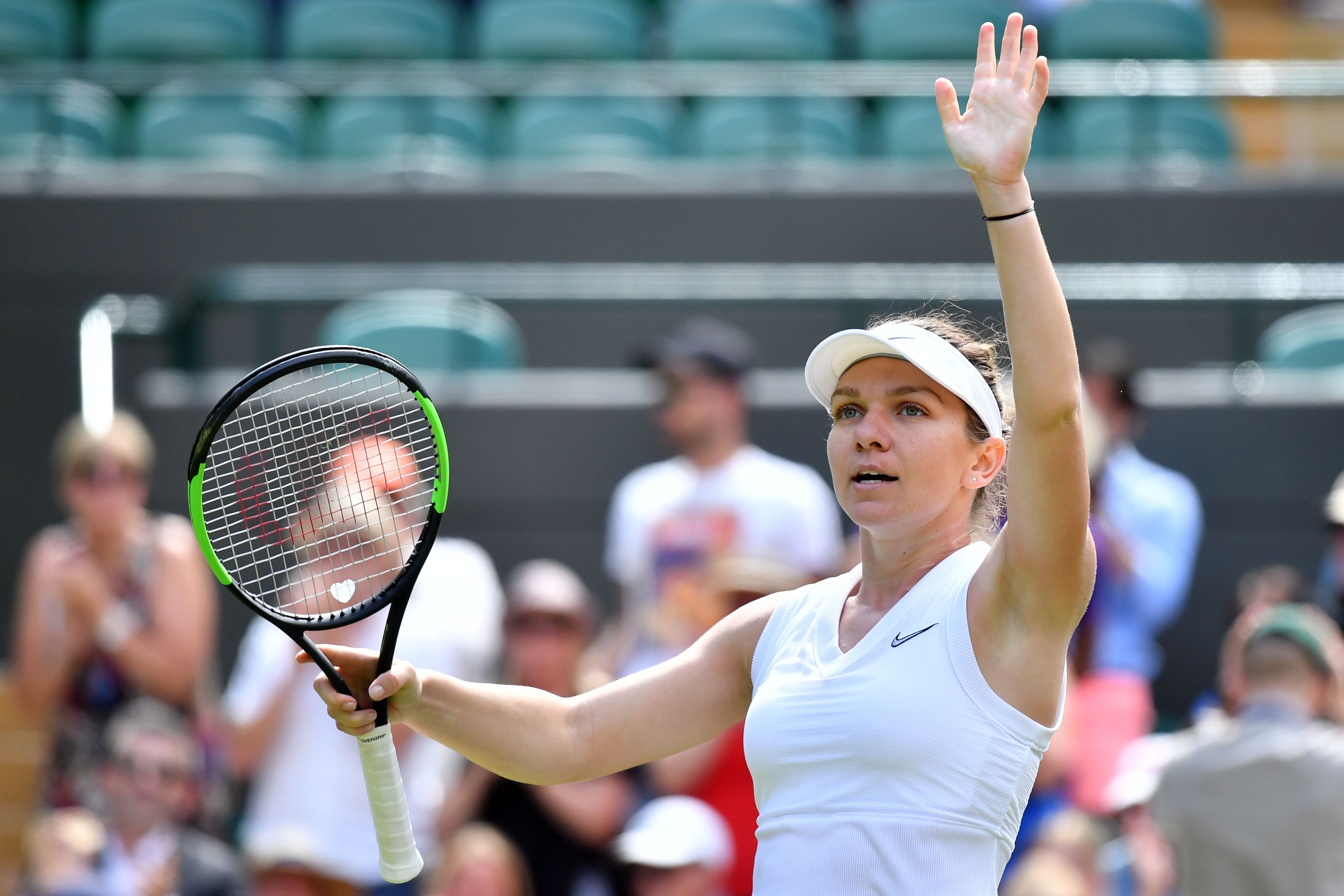 Petenis Rumania Simona Halep saat tampil di Turnamen Tenis Wimbledon 2019.