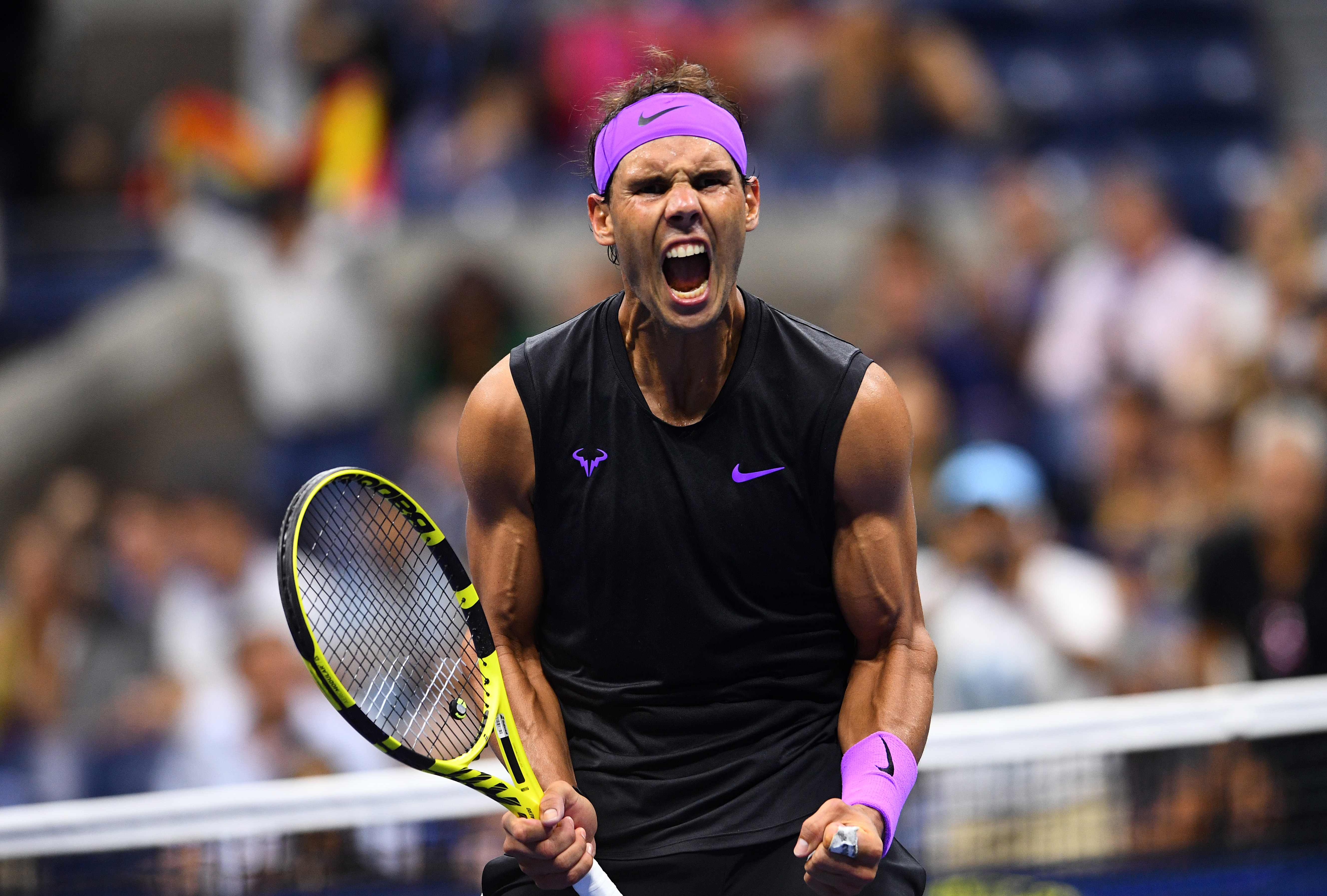 Rafael Nadal dari Spanyol bereaksi setelah menang melawan Diego Schwartzman dari Argentina selama pertandingan perempat final Putra Tunggal 