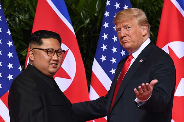 Pemimpin Korea Utara Kim Jong Un dan Presiden Amerika Serikat Donald Trump