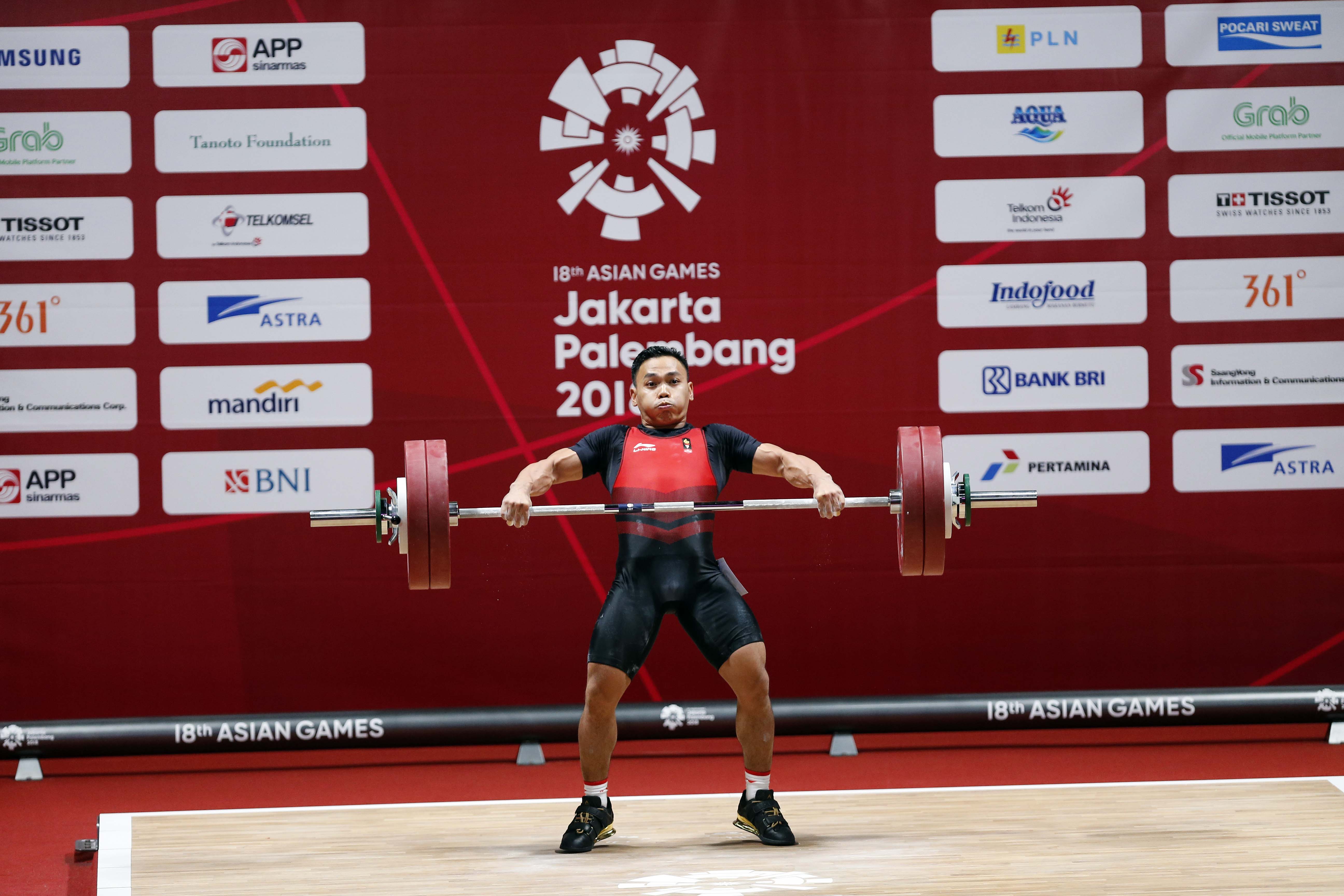Lifter Indonesia Eko Yuli Irawan saat bertanding di Asian Games 2018