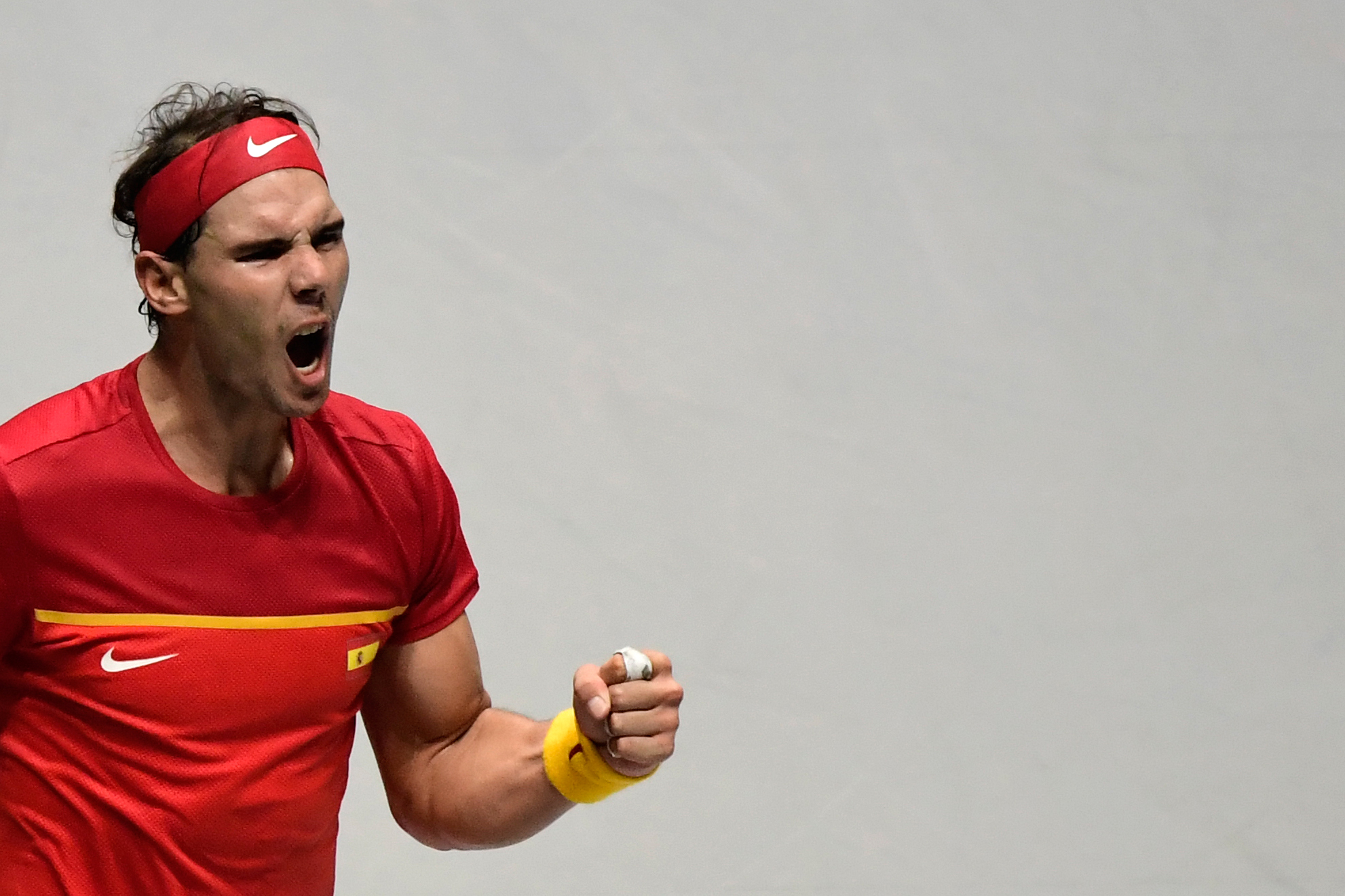 Rafael Nadal bereaksi usai mengalahkan petenis Rusia Karen Khachanov dalam laga Piala Davis