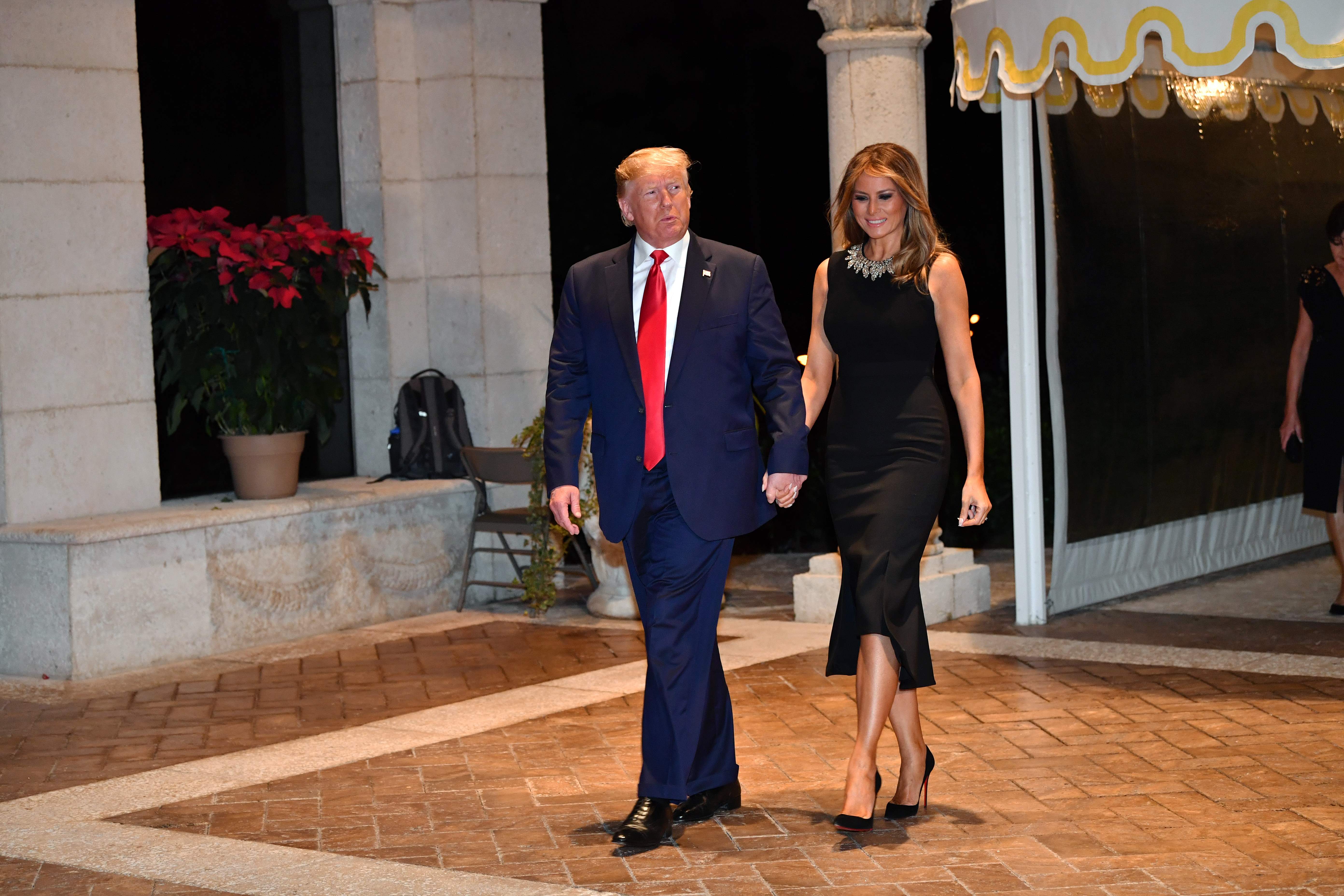 presiden AS Donald Trump bersama istrinya Melania di resor pribadinya Mar-a-Lago, Florida, AS