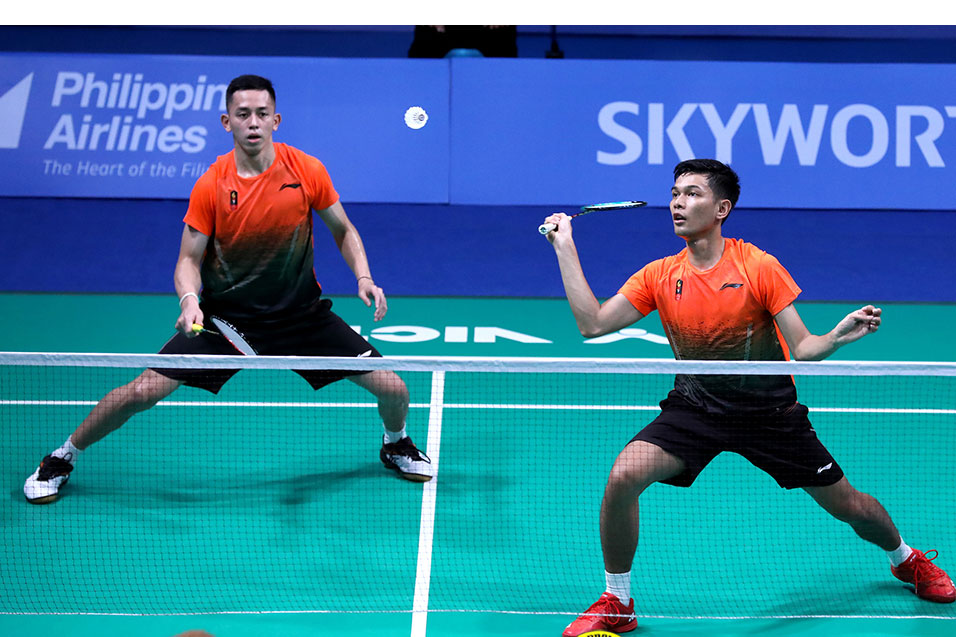 Muhammad Rian Ardianto (kiri) dan Fajar Alfian (kanan) saat melawan ganda putra Malaysia di SEA Games 2019