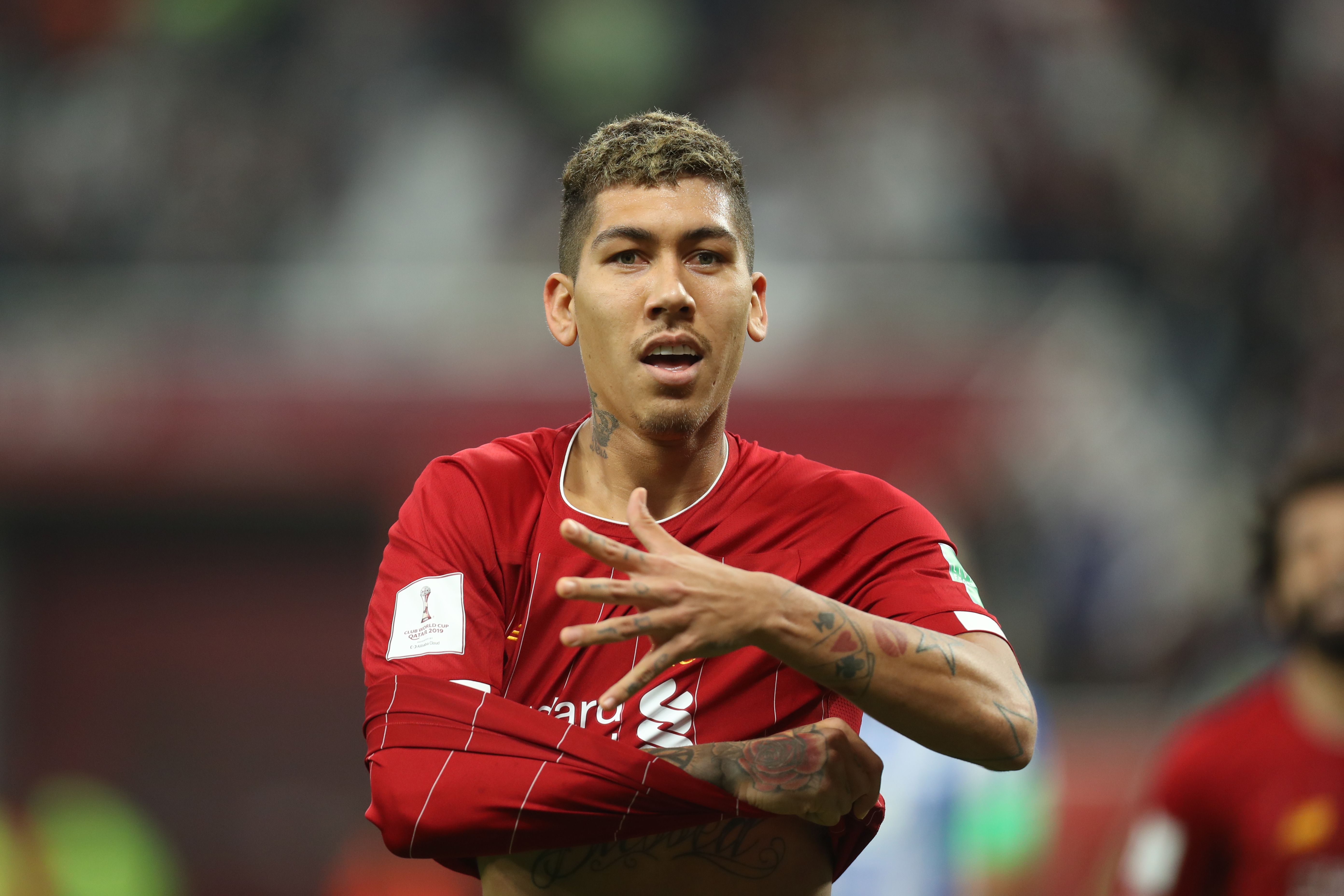 Penyerang Liverpool Roberto Firmino melakukan selebrasi usai mencetak gol ke gawang Monterrey di laga semifinal Piala Dunia Antarklub.