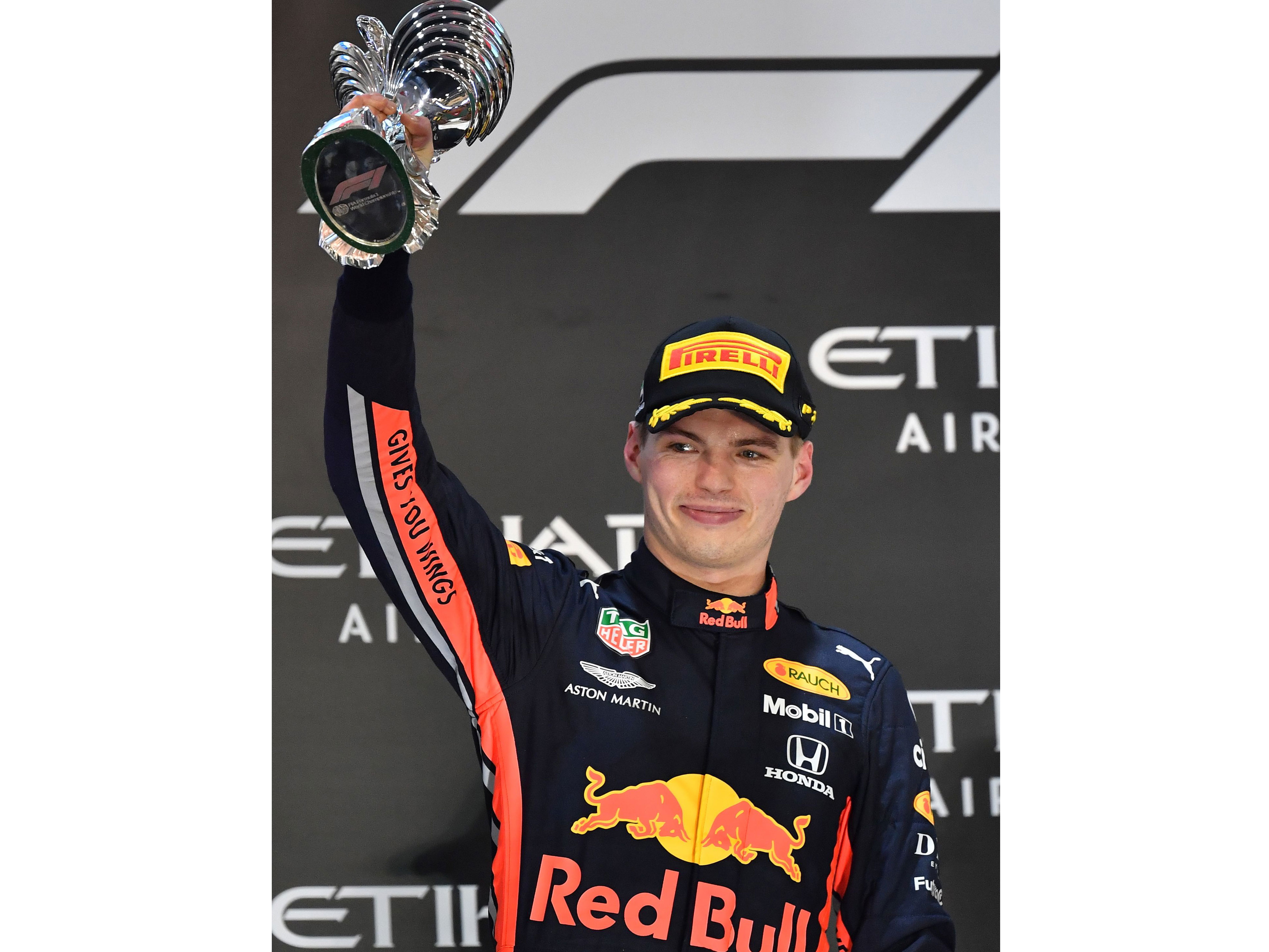 Pembalap Belanda Red Bull Racing Max Verstappen merayakan finish ke-2 di podium di Sirkuit Yas Marina di Abu Dhabi, 
