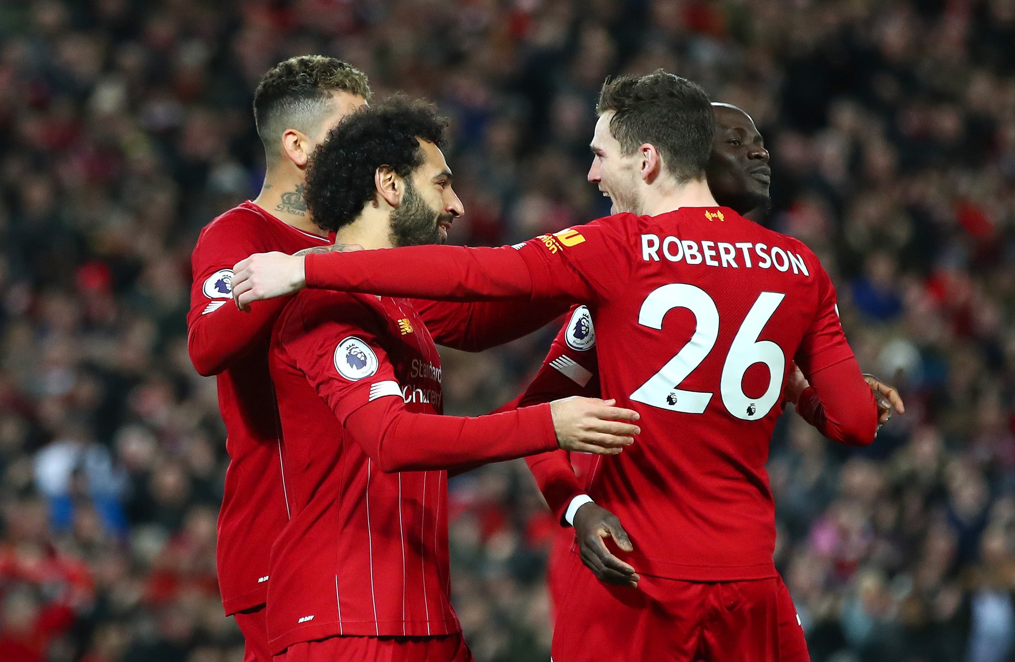 Mohamed Salah (tengah) bersama para pemain Liverpool lainnya merayakan golnya ke gawang Sheffield United