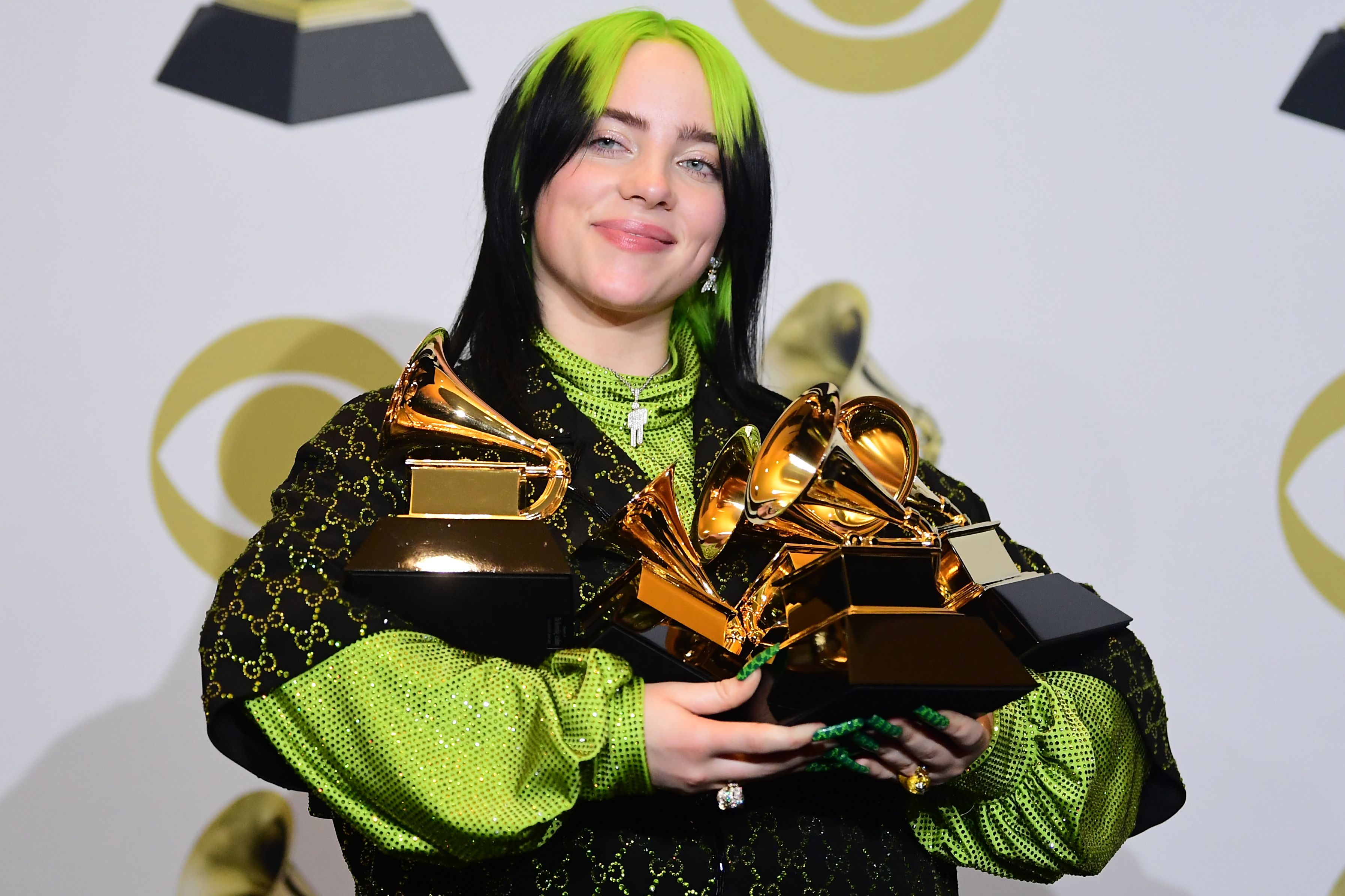 Penyanyi Billie Eilish berpose dengan piala Album Of The Year, Record Of The Year, Best New Artist, Song Of The Year and Best Pop Vocal