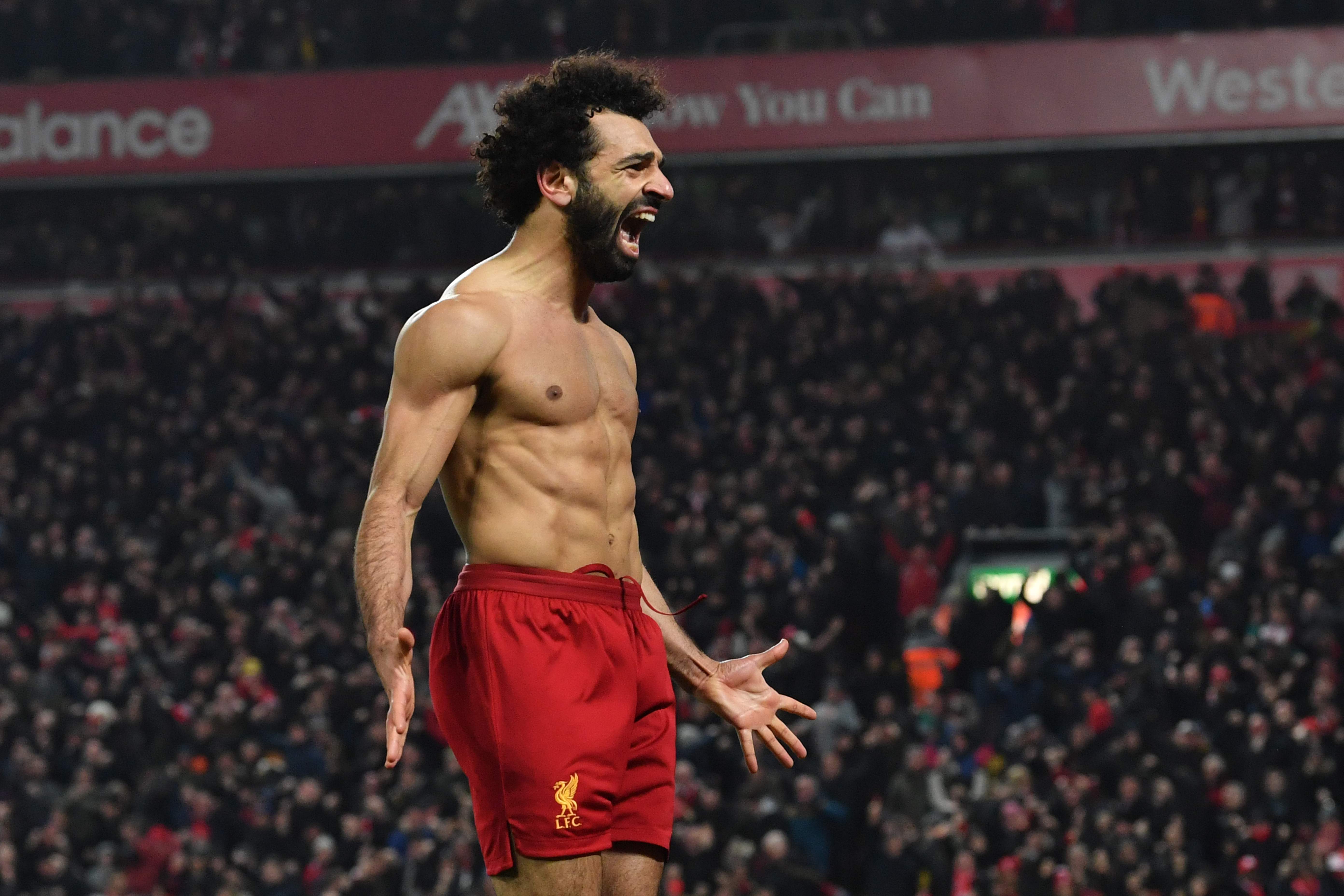 Mohamed Salah berselebrasi setelah mencetak gol ke gawang MU