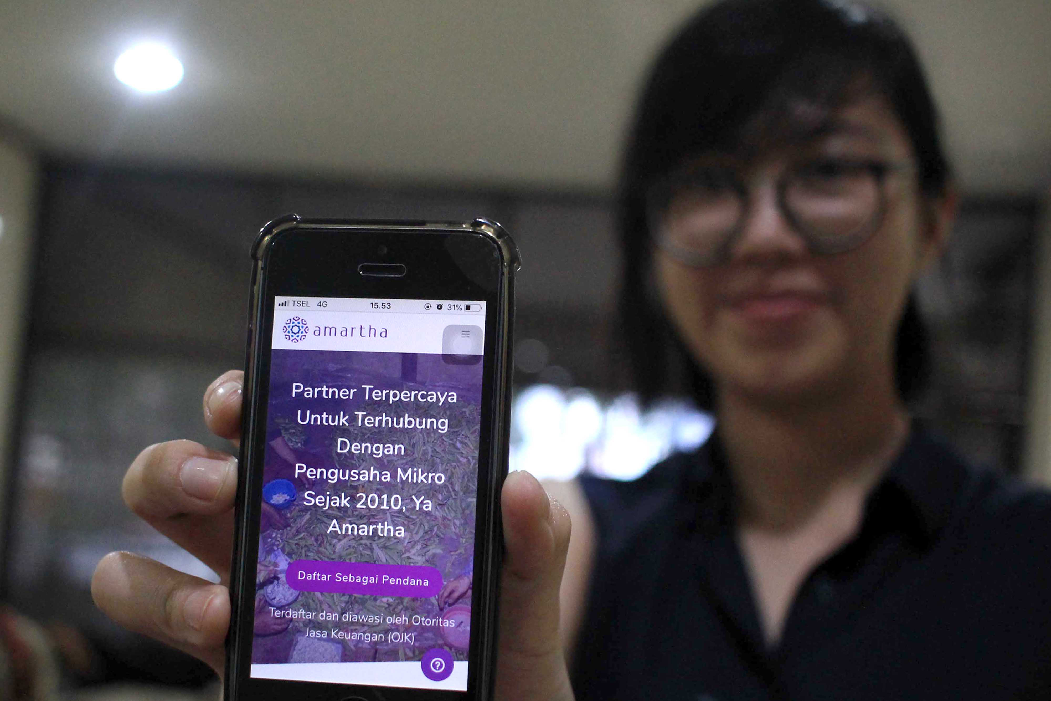 Manager PT Amartha Mikro Fintek Lydia M Kusnadi.