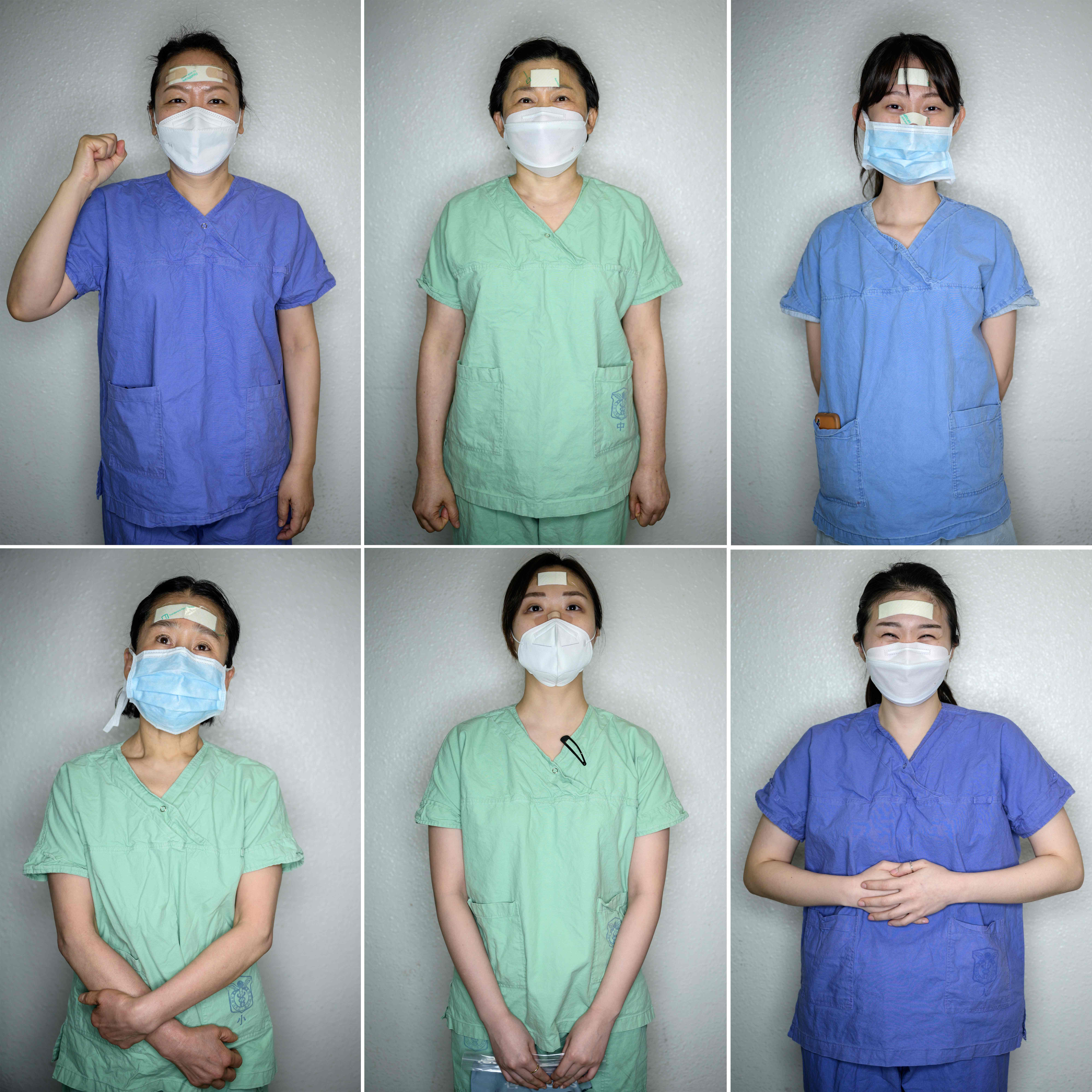 Perawatdan sukarelawan di  Keimyung University hospital memakai plester untuk melindungi wajah mereka sekaligus tanda kehormatan