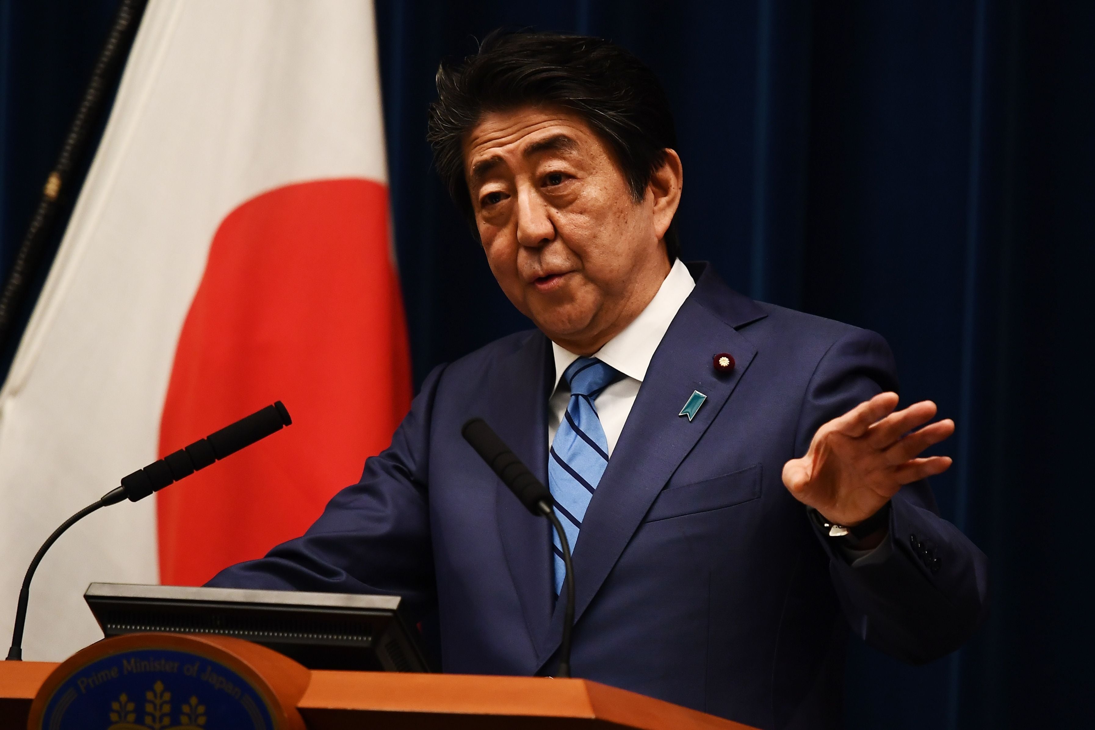  Perdana Menteri Jepang Shinzo Abe berbicara kepada media selama konferensi pers di Tokyo pada 14 Maret 2020.