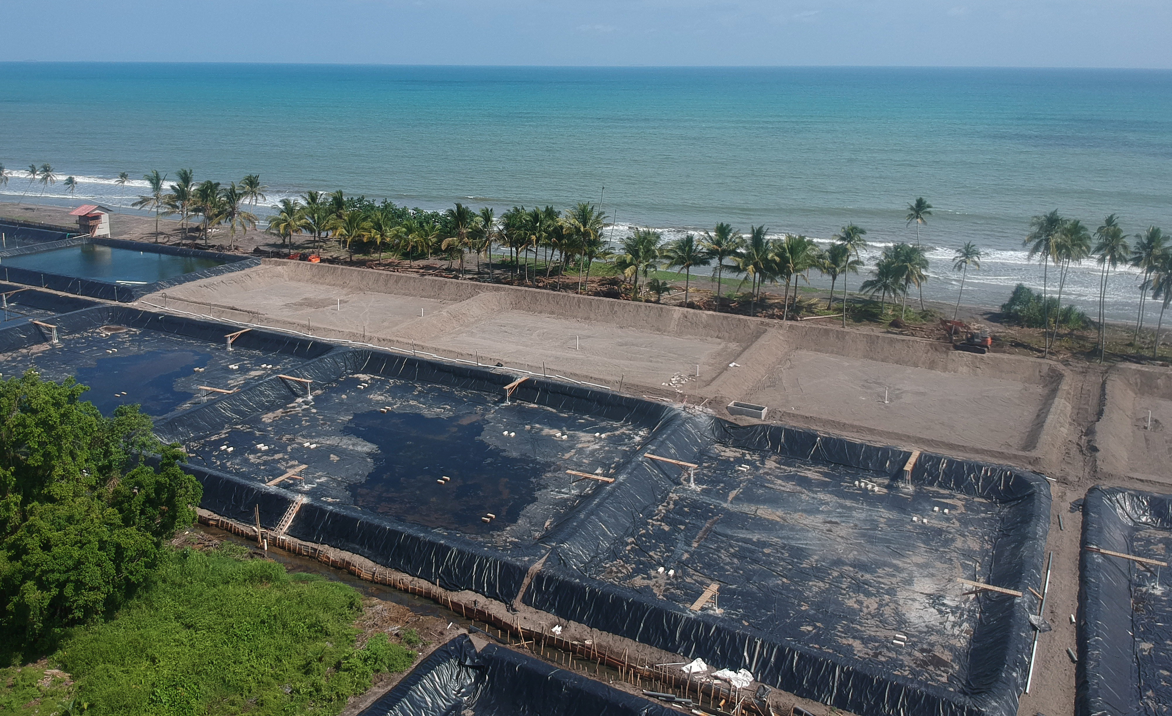 Foto udara, alat berat bekerja membuka tambak udang baru, di Ulakan, Kab.Padangpariaman, Sumatera Barat, Selasa (21/7/2020).