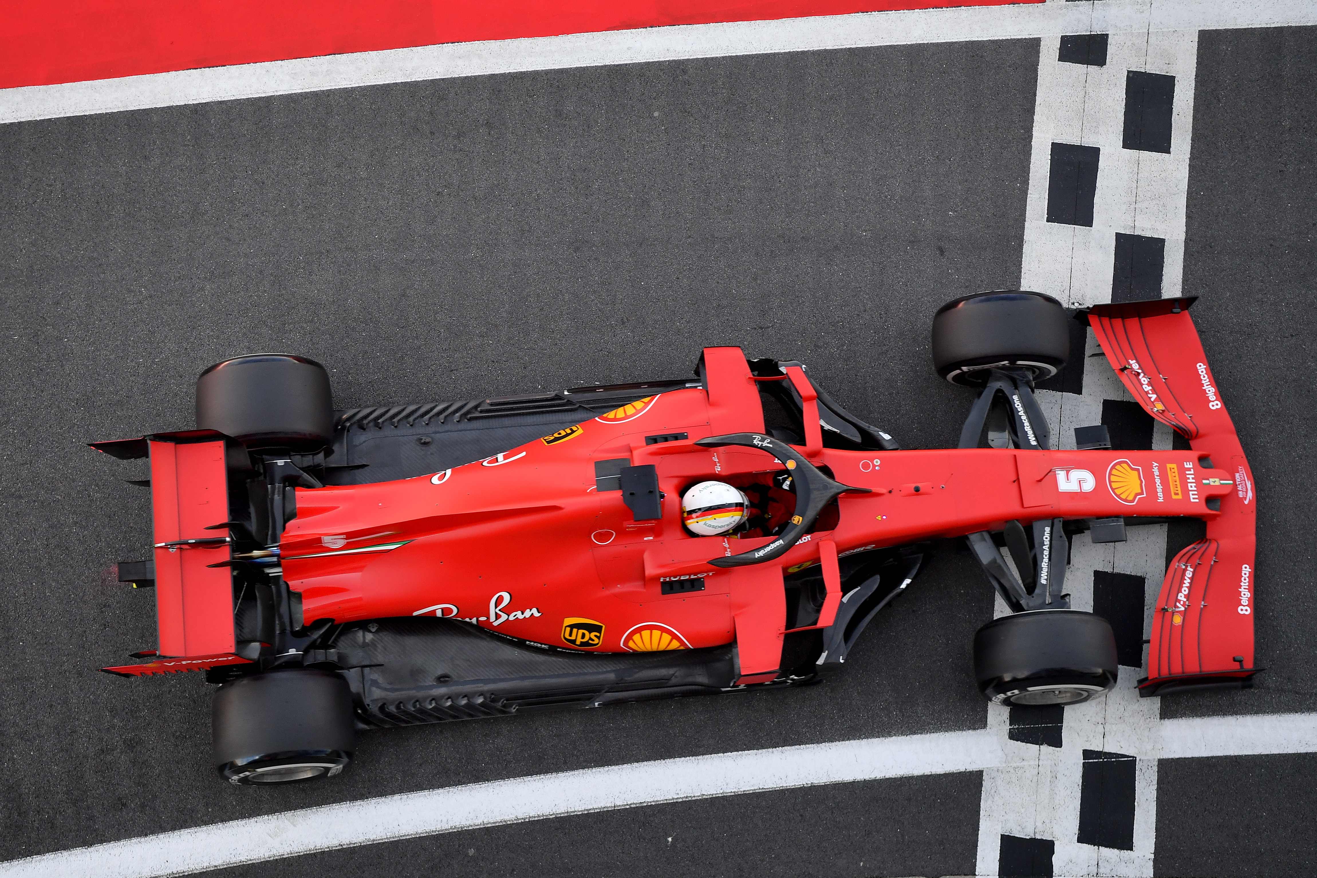 Pembalap Ferrari Sebastian Vettel saat tampil di Sirkuit Silverstone, Inggris, pekan lalu. 