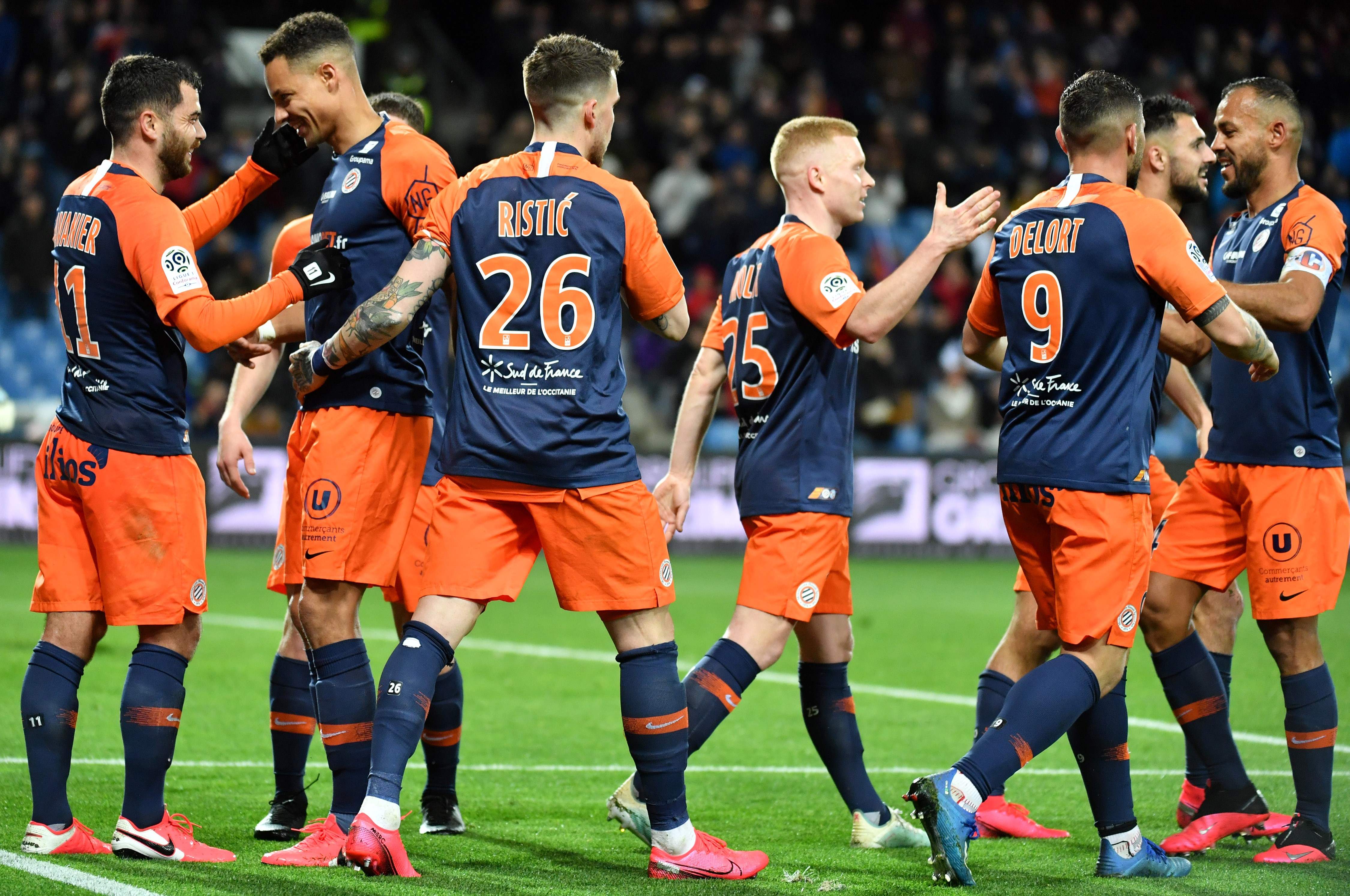 Pemain Montpellier melakukan selebrasi usai mencetak gol ke gawang lawan. 