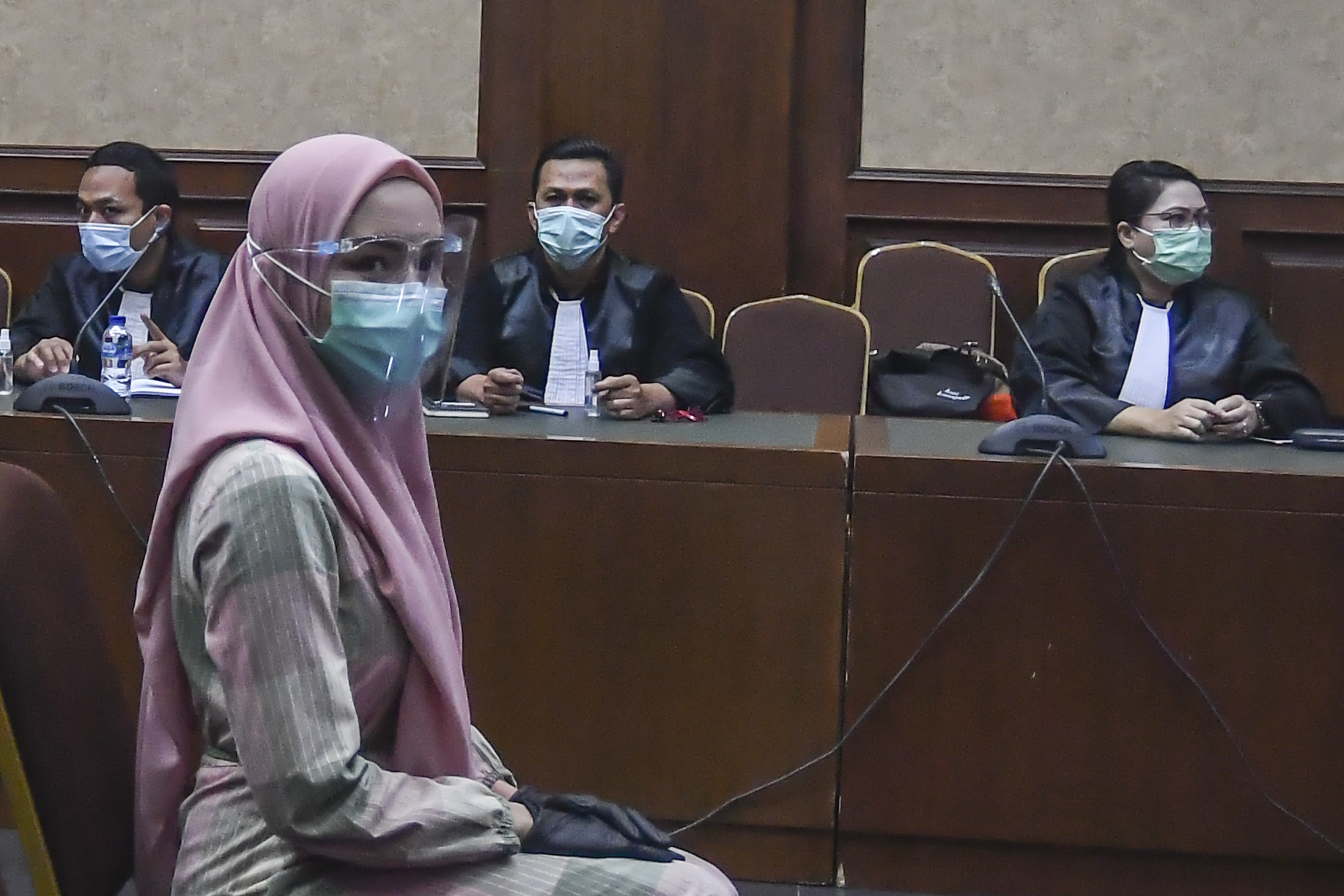 Terdakwa kasus suap pengurusan pengajuan fatwa MA untuk membebaskan Djoko Tjandra, Pinangki Sirna Malasari, mengikuti sidang perdana. 