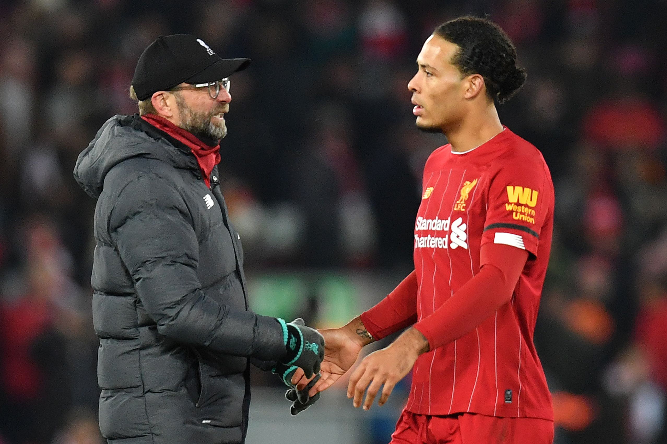 Manajer Liverpool Juergen Klopp dan bek Virgil van Dijk.