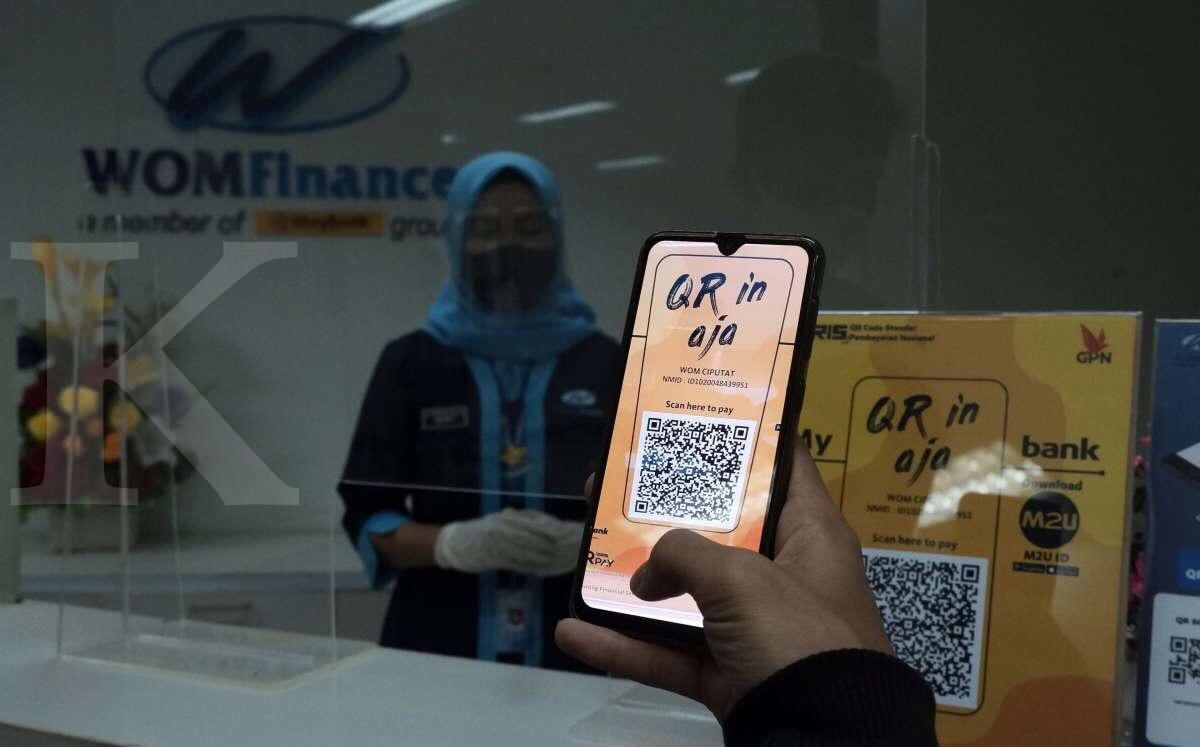 Pelayanan menggunakan QR code di WOM Finance