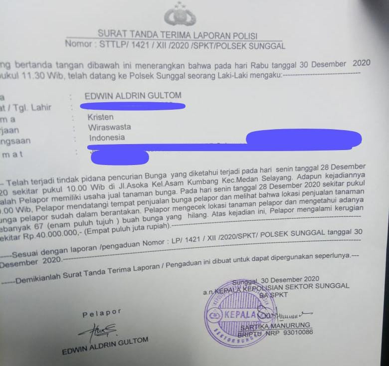 Surat tanda terima laporan polisi.