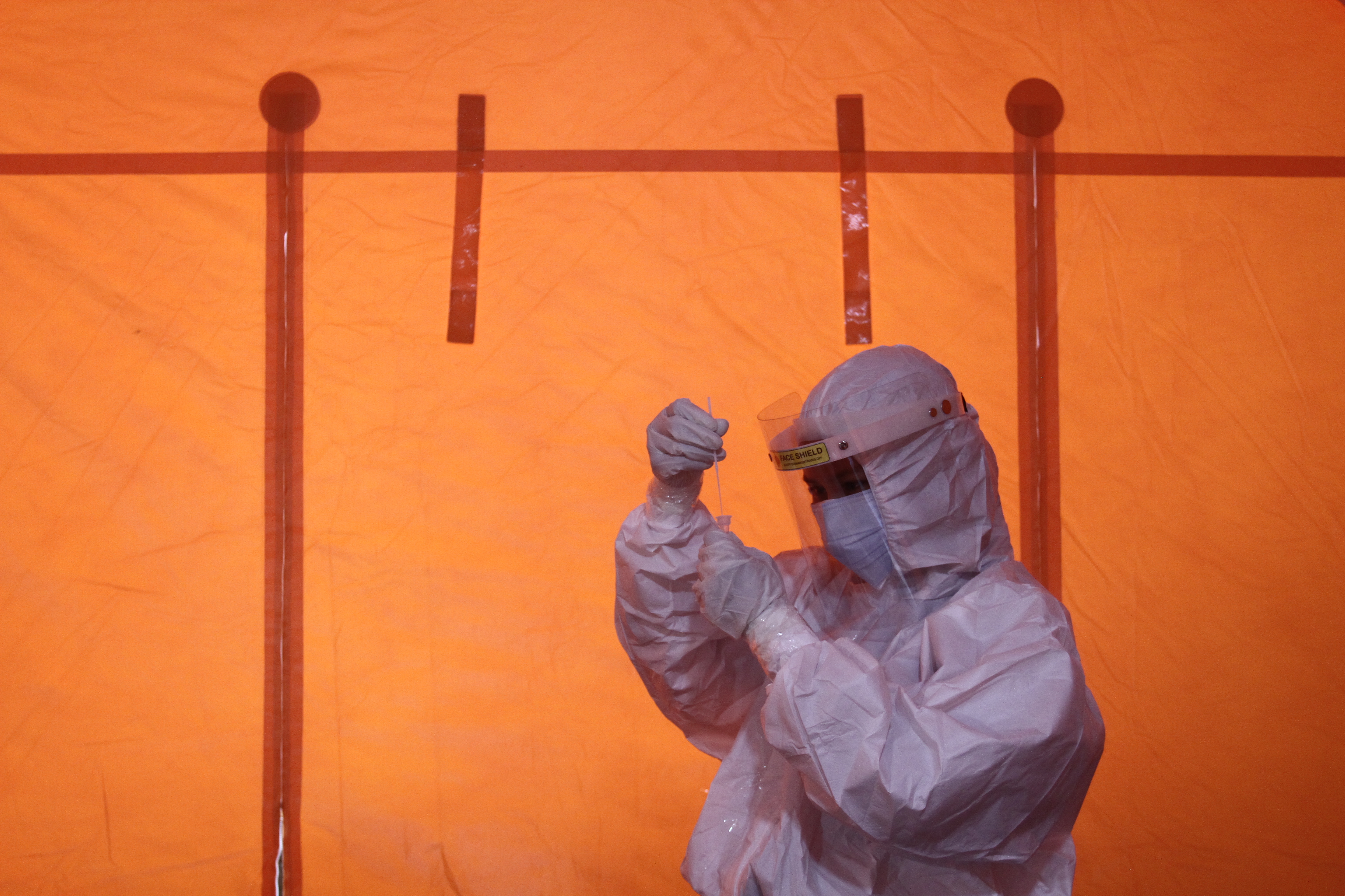 Petugas medis memproses hasil tes swab antigen di posko penanganan covid-19 di Yogyakarta.