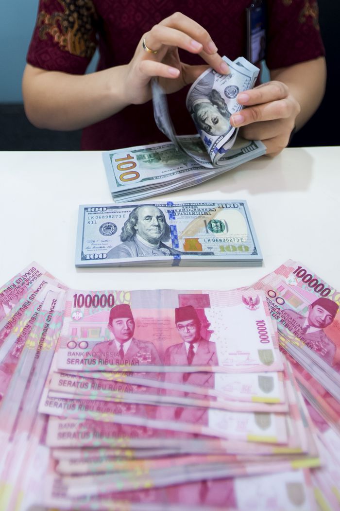 Ilustrasi: Rupiah dan Dolar AS.