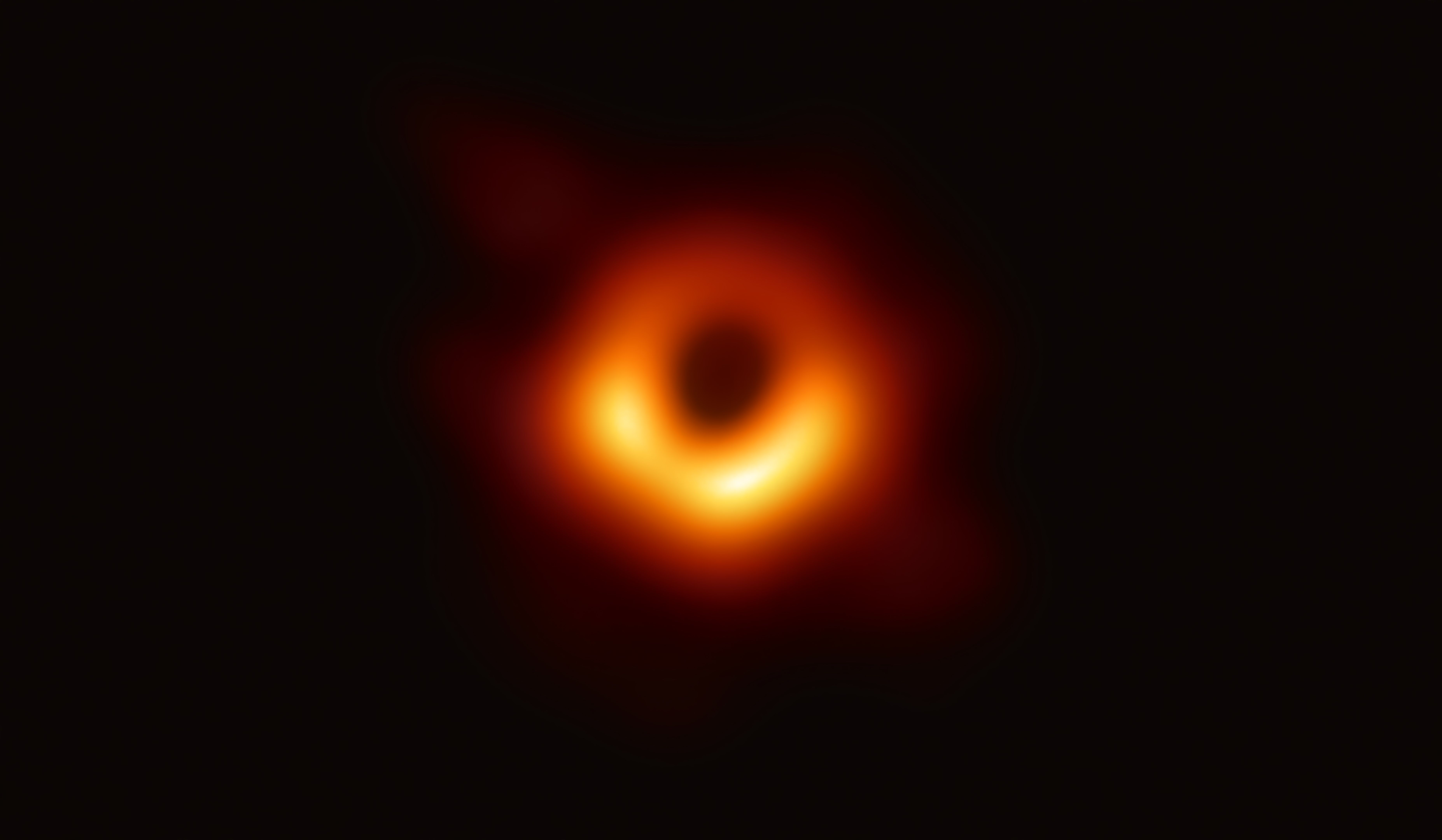 Foto lubang hitam (black hole) dan lingkaran cahaya berapi, yang dirilis oleh astronom Event Horizon Telescope (EHT) tahun 2019. 
