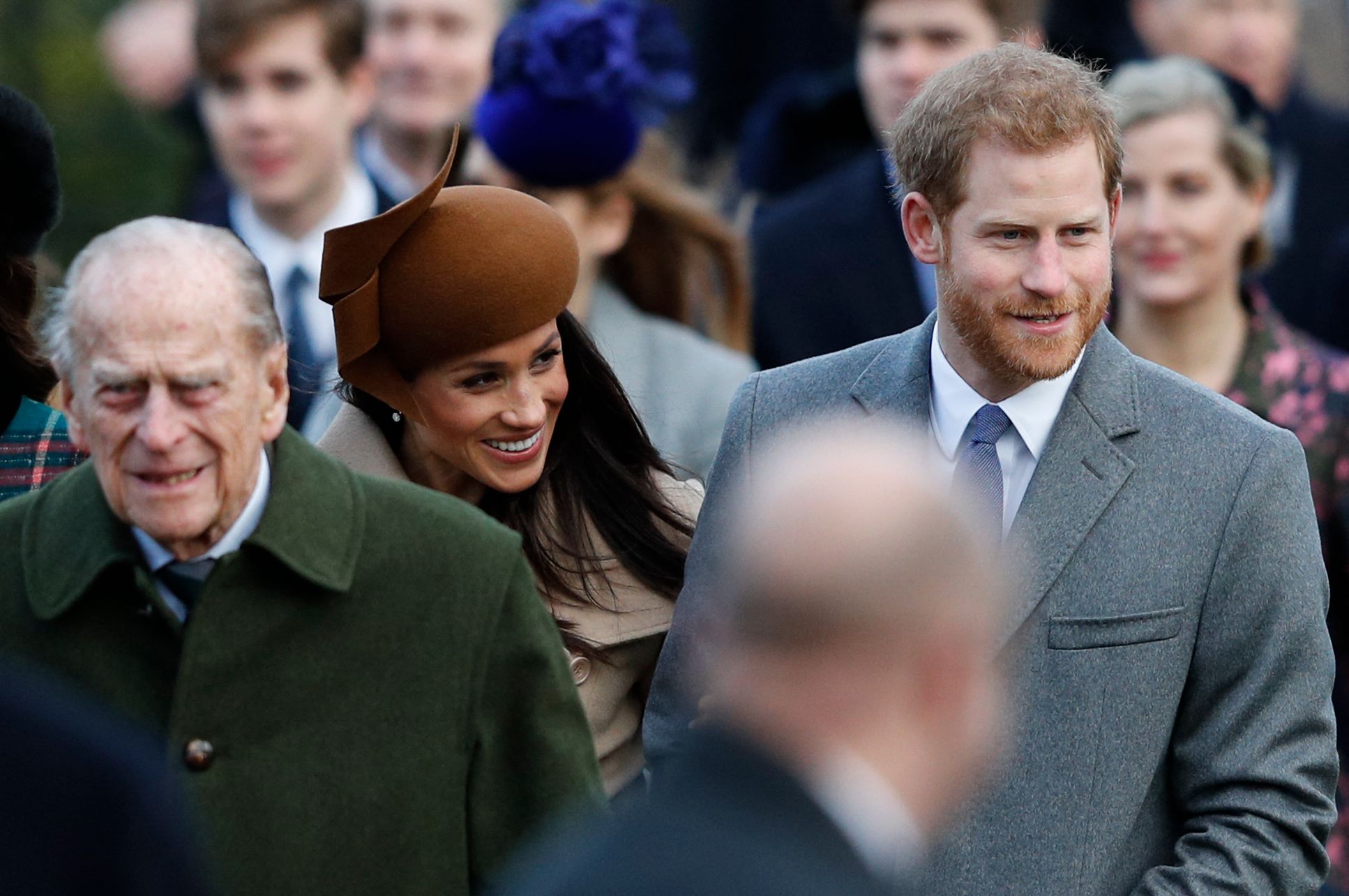 Pangeran Philip (kiri) bersama pasangan Pangeran Harry dan Meghan Markle