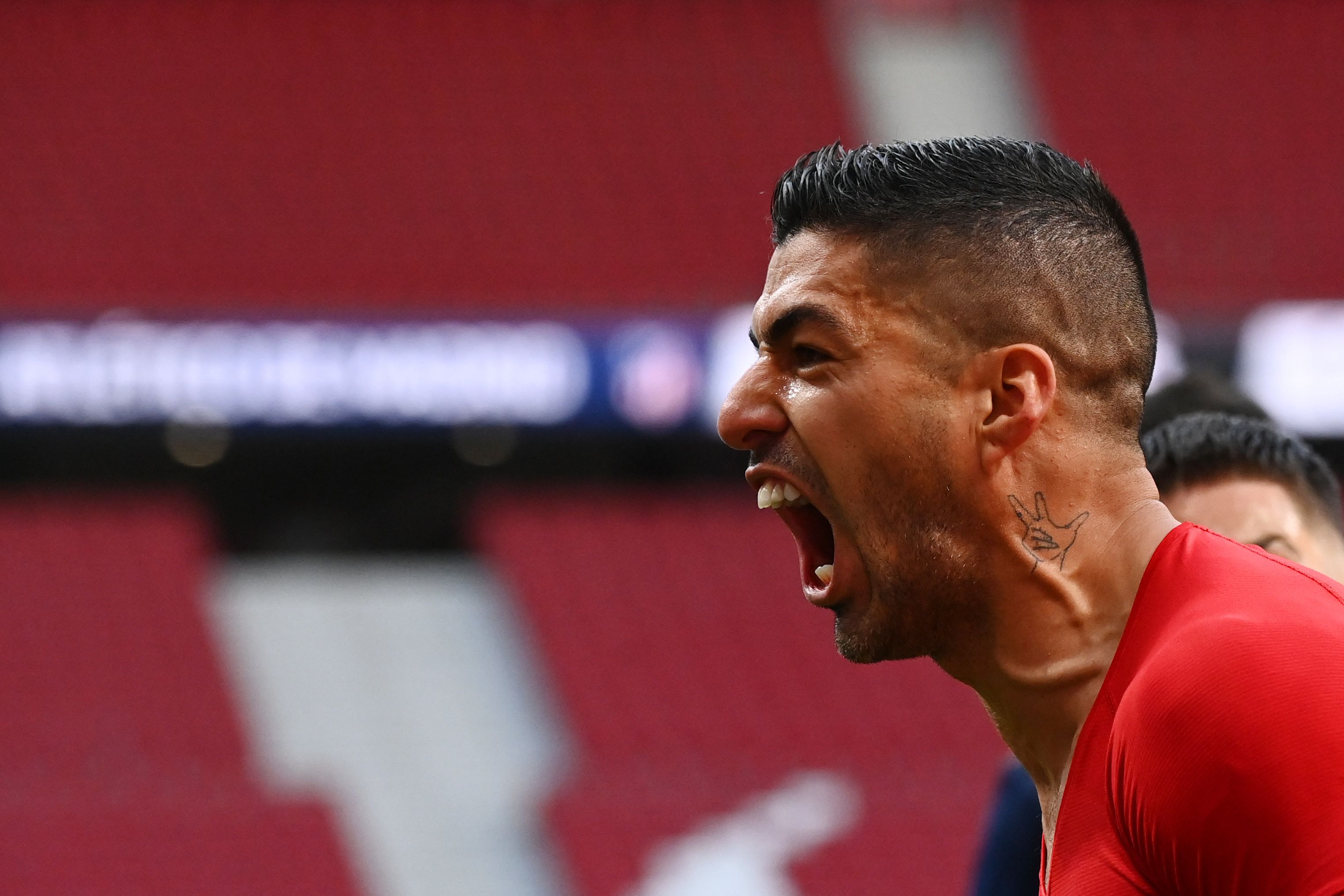 Pemain Atletico Madrid Luis Suarez saat merayakan gol.