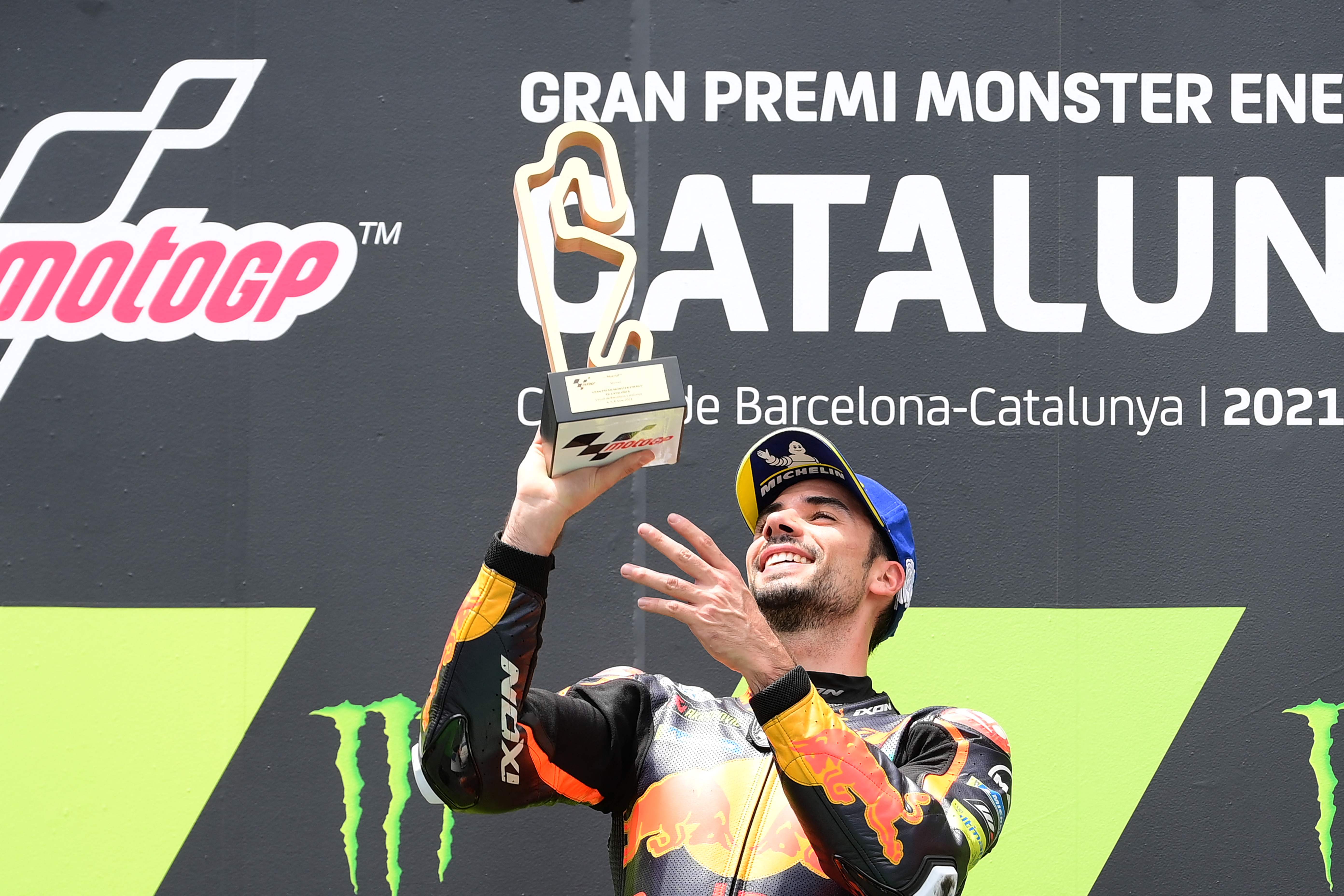 Pembalap KTM Miguel Oliveira merayakan kemenangan di MotoGP Catalonia