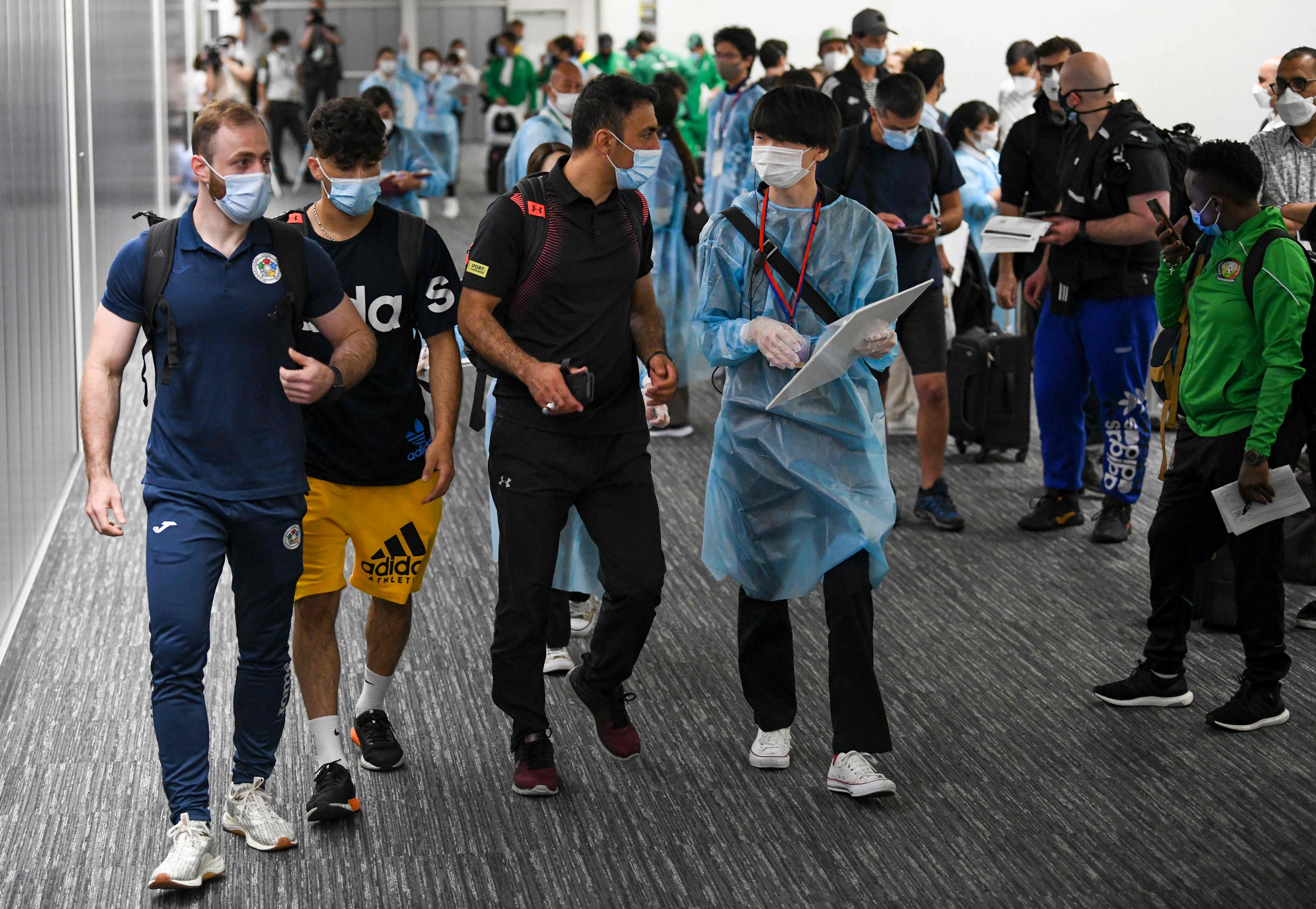 Tiga anggota kontigen tim pengungsi untuk Olimpiade Tokyo tiba di Bandara Narita, Rabu (14/7) lalu.