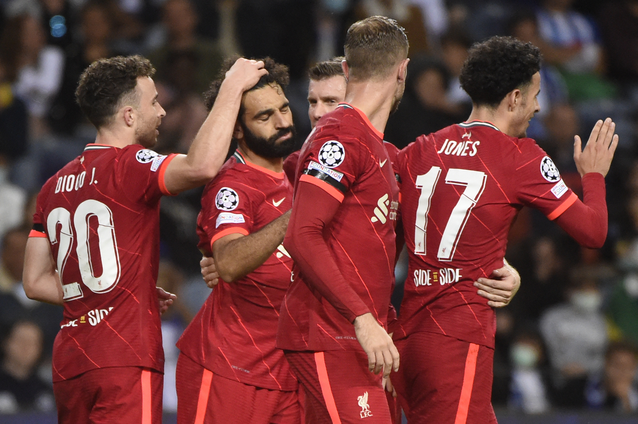 Para pemain Liverpool melakukan selebrasi usai mencetak gol ke gawang Porto di laga Liga Champions.