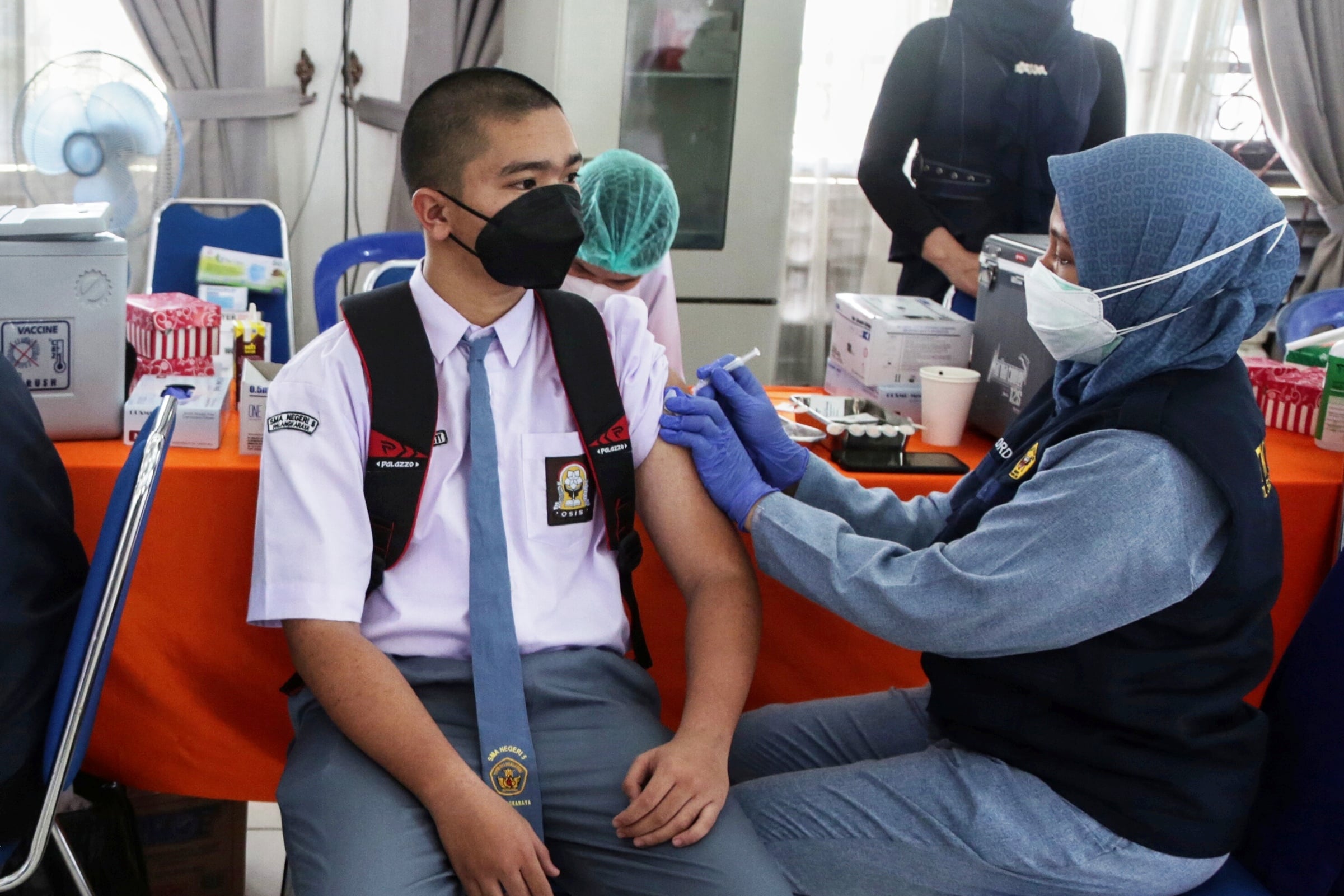 Ilustrasi vaksinasi pelajar.