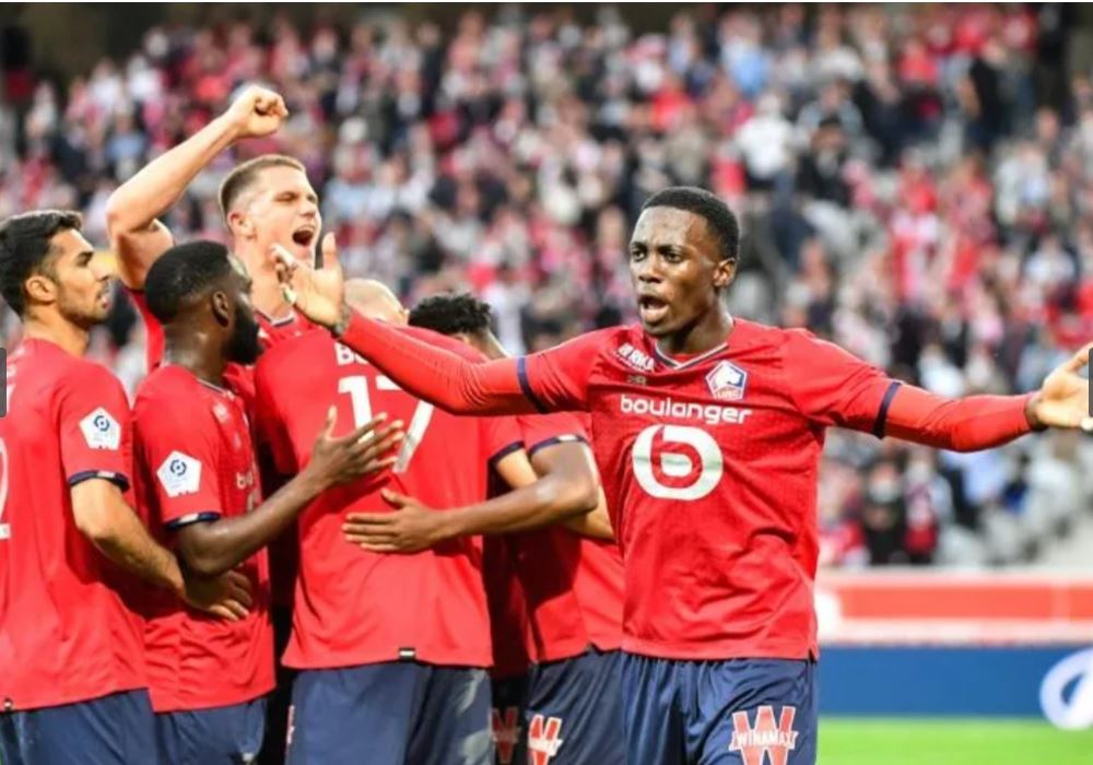 Para pemain Lille melakukan selebrasi usai mencetak gol ke gawang Reims di laga Ligue 1.