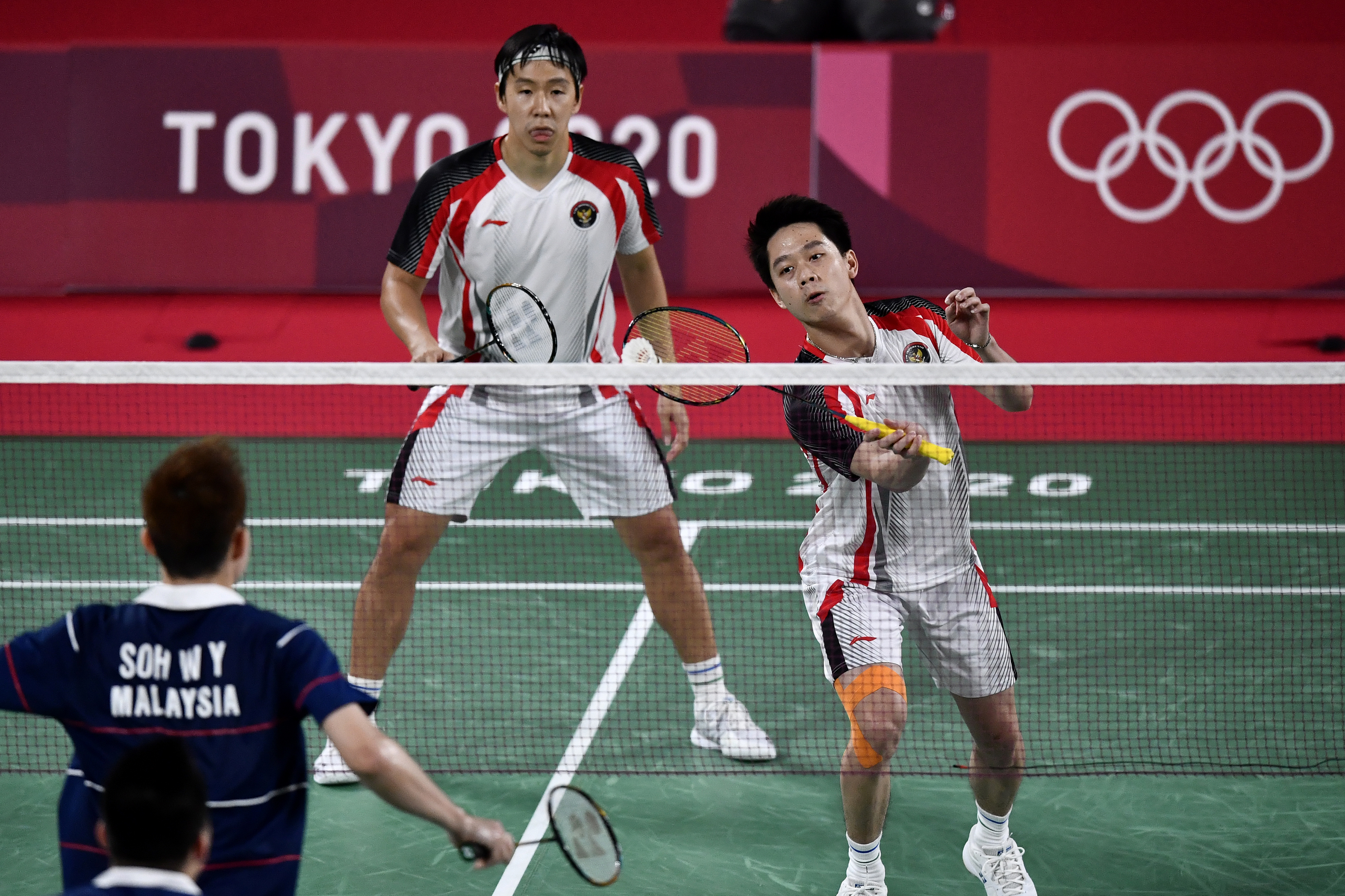 Ganda putra Marcus Fernaldi Gideon/Kevin Sanjaya Sukamuljo saat menghadapi pasangan Malaysia di Piala Sudirman.