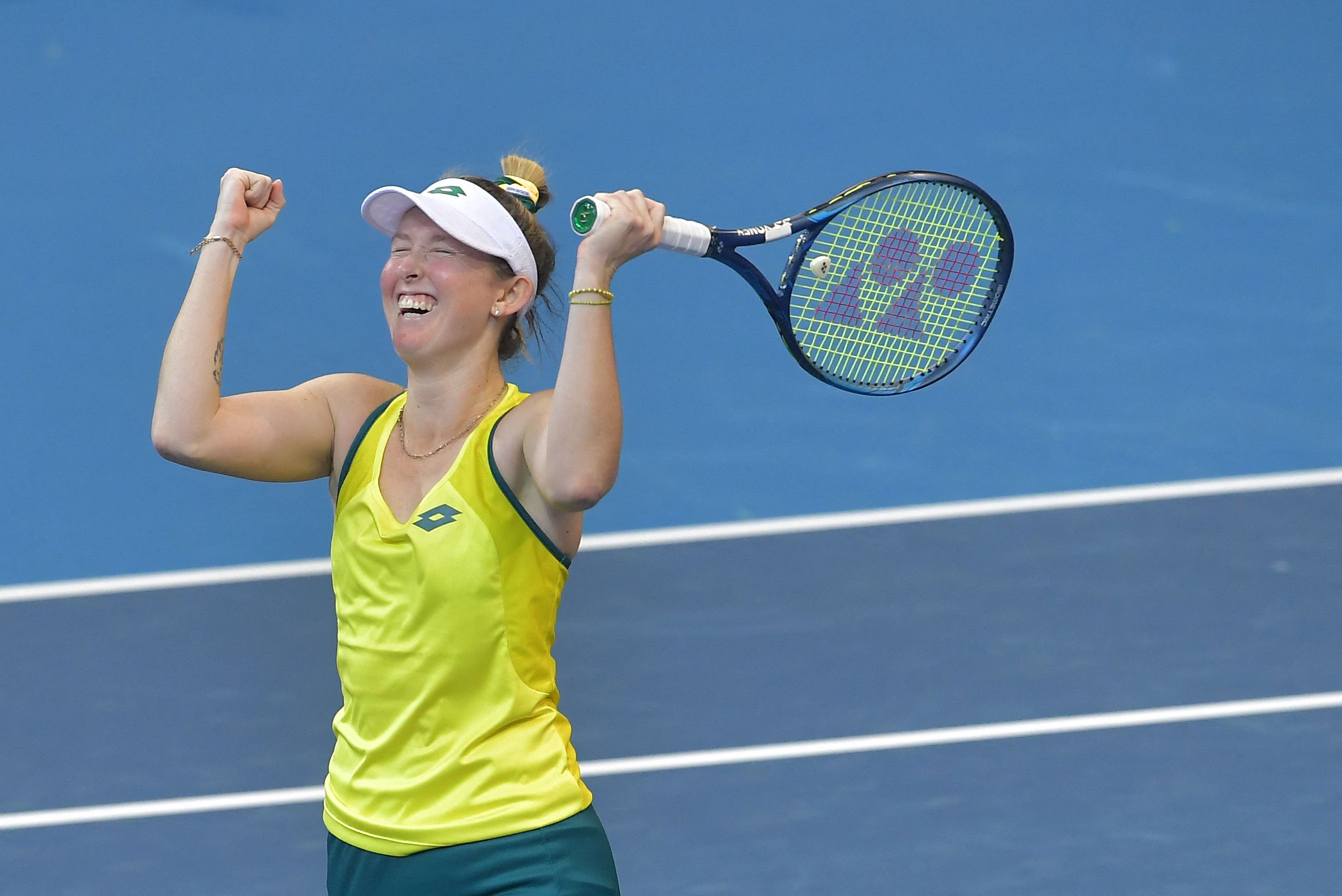 Petenis Australia Storm Sanders melakukan selebrasi usai mengalahkan Petenis Belgia Elise Mertens di Piala Billie Jean King.  