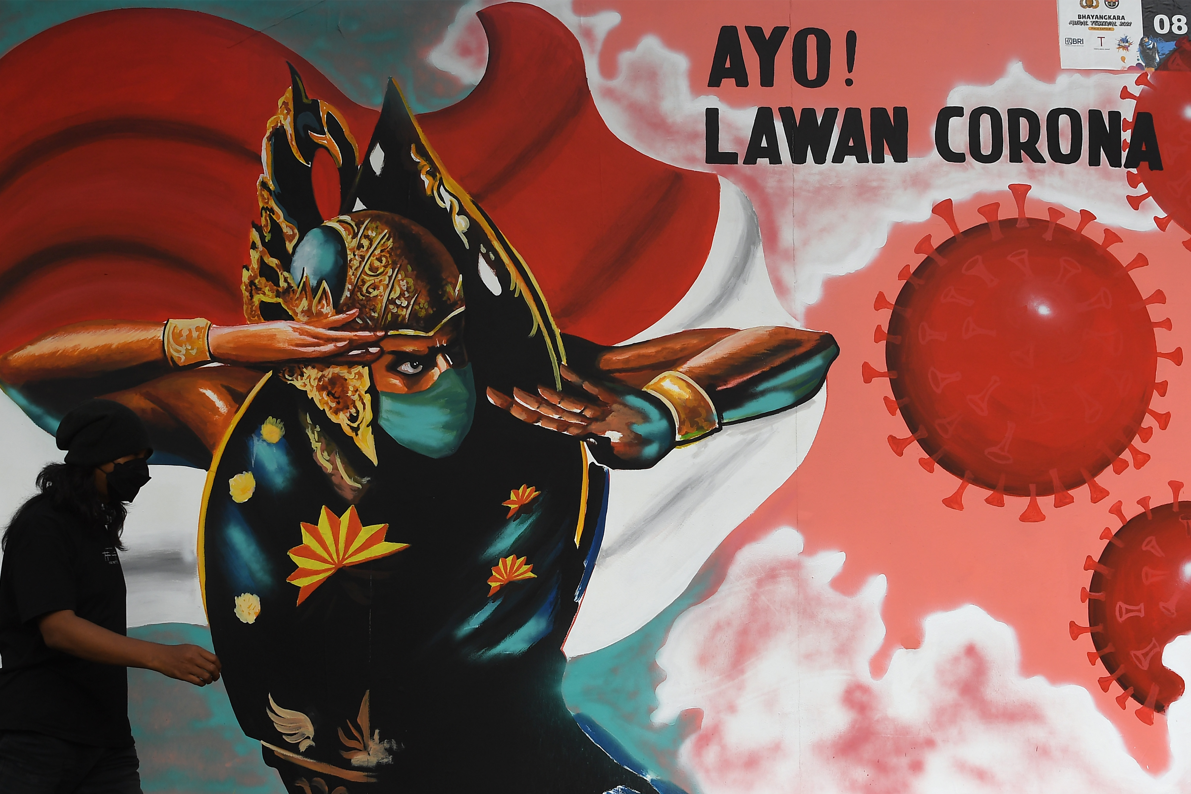 Mural peringatan lawan Covid-19 di Jakarta