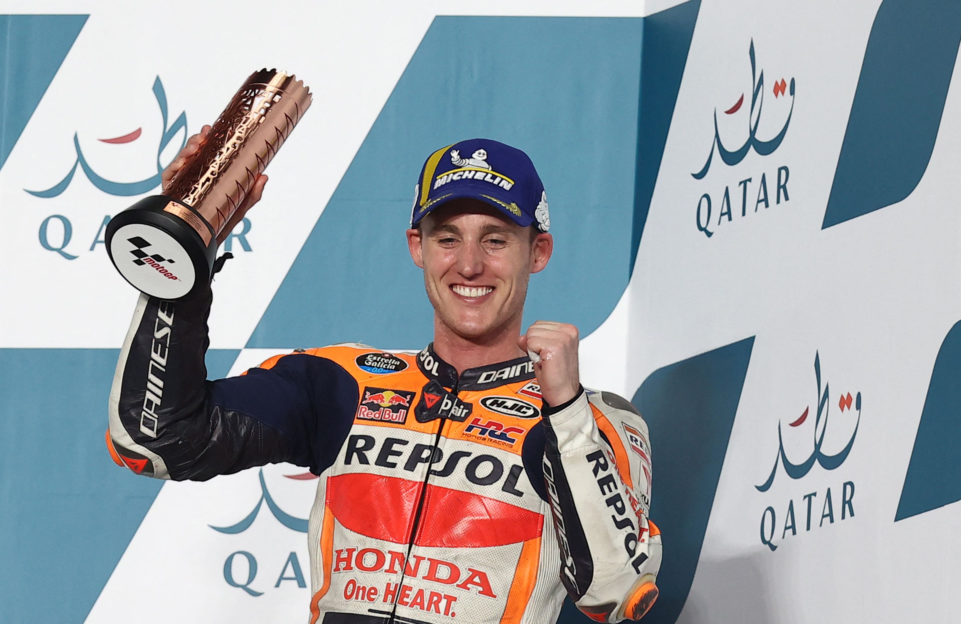 Pembalap Repsol Honda Pol Espargaro merayakan finis ketiga di GP Qatar.