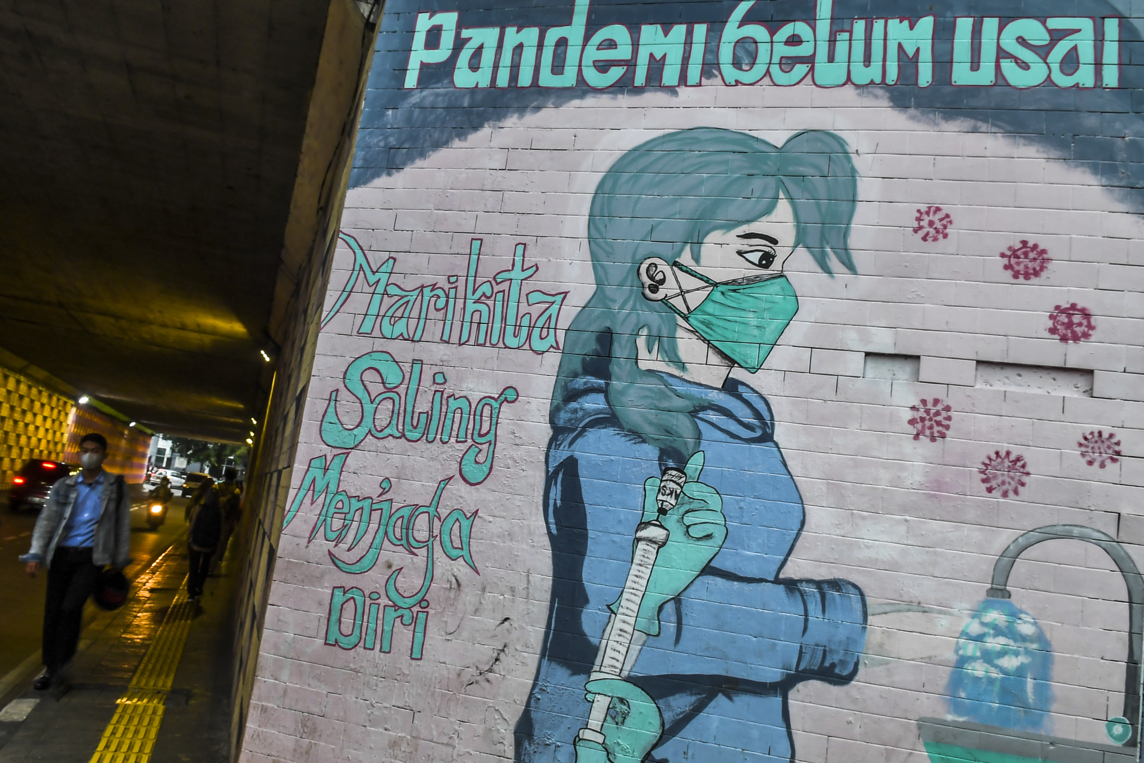 Mural peringatan bahaya Covid-19