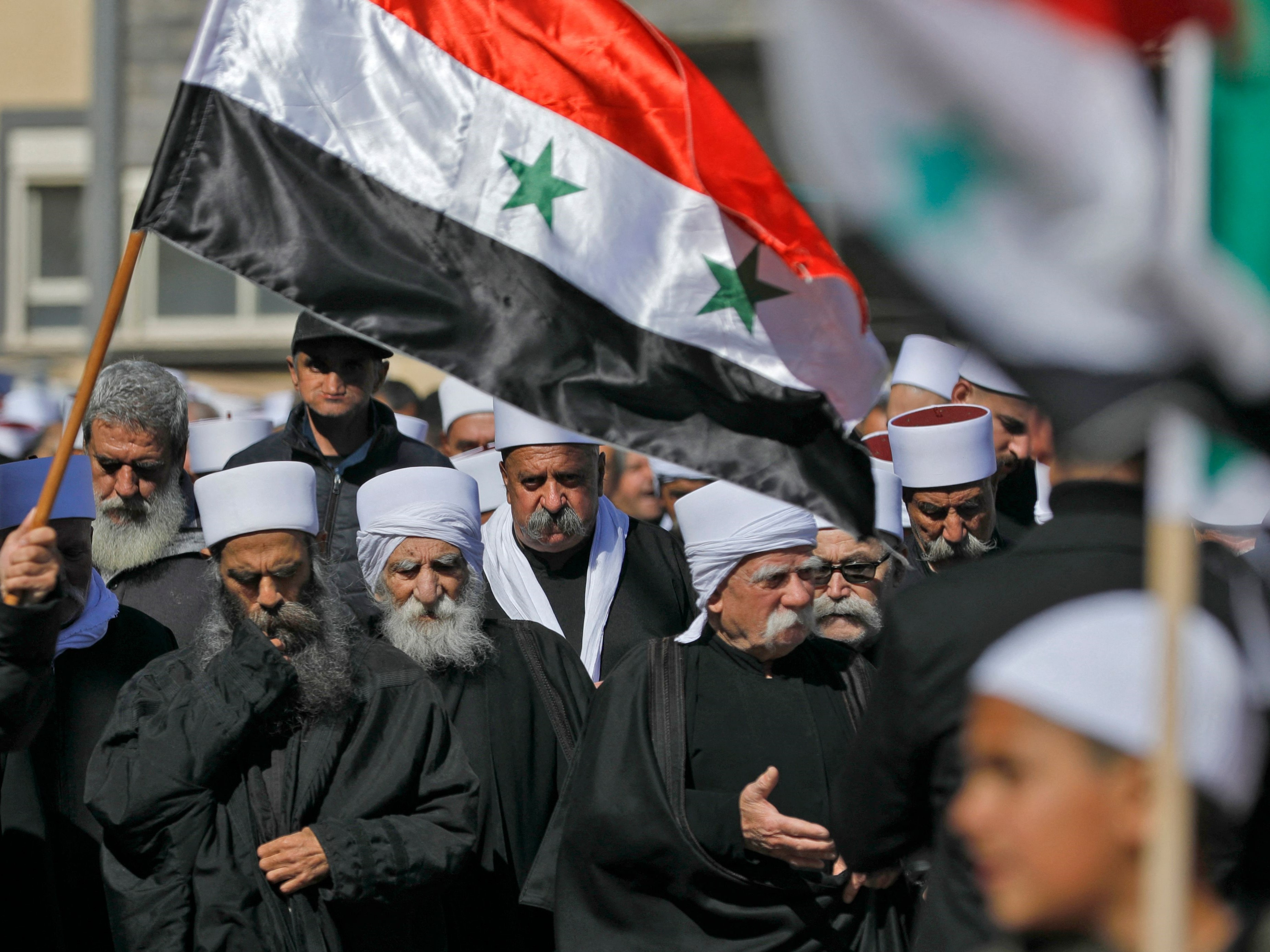 Penduduk Druze di Dataran Tinggi Golan ambil bagian dalam unjuk rasa di desa Majdal Shams di Dataran Tinggi Golan yang dicaplok Israel.