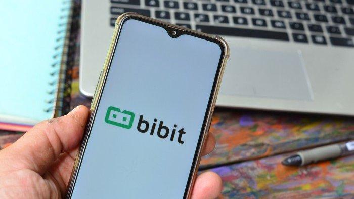 Ilustrasi aplikasi investasi Bibit.id pada smartphone.