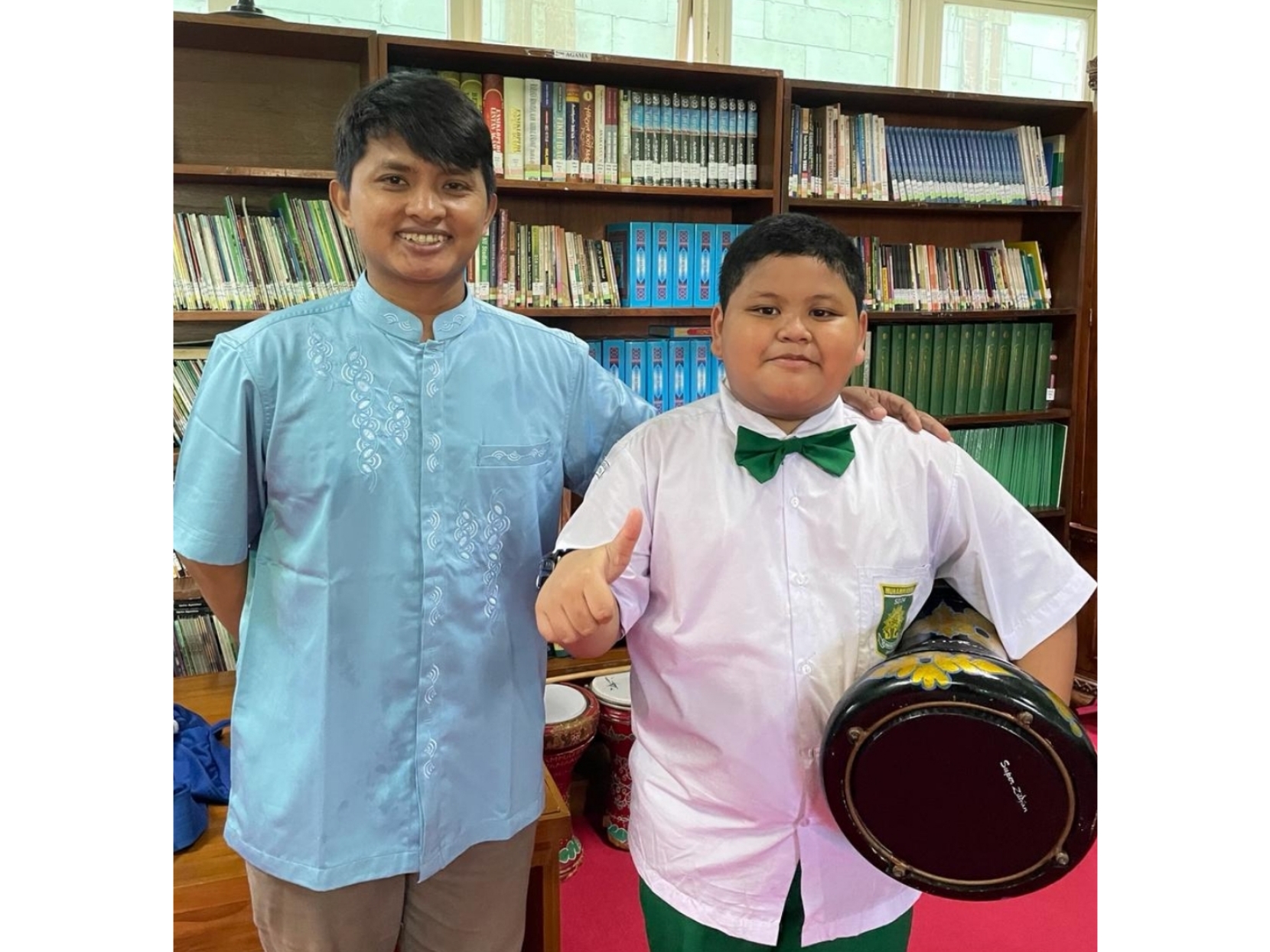 Albyan Kaindra Farzan (kanan) bersama Kak Hamzah.