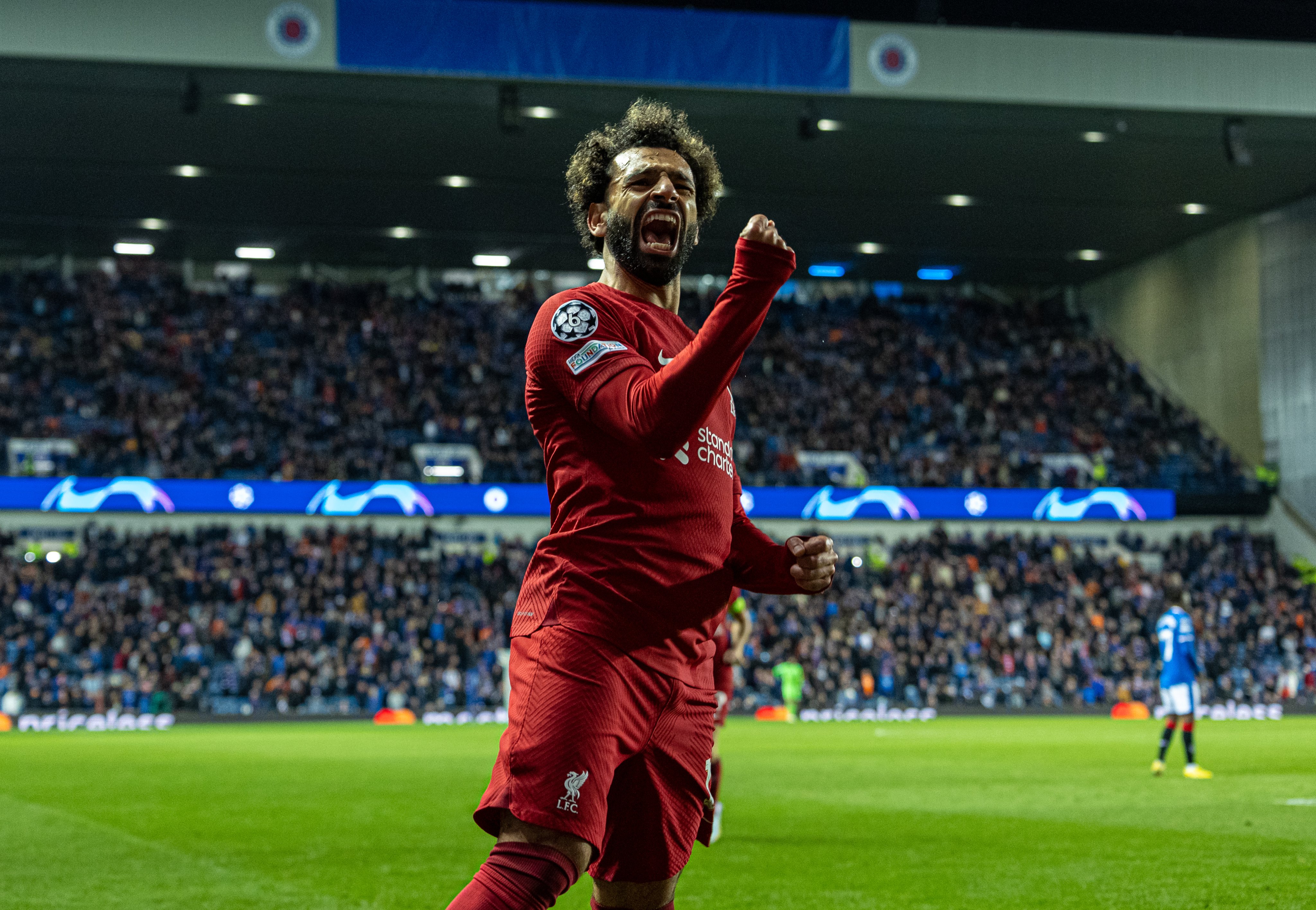 Penyerang Liverpool Mohamed Salah melakukan selebrasi usai mencetak gol ke gawang Rangers di laga Liga Champions.